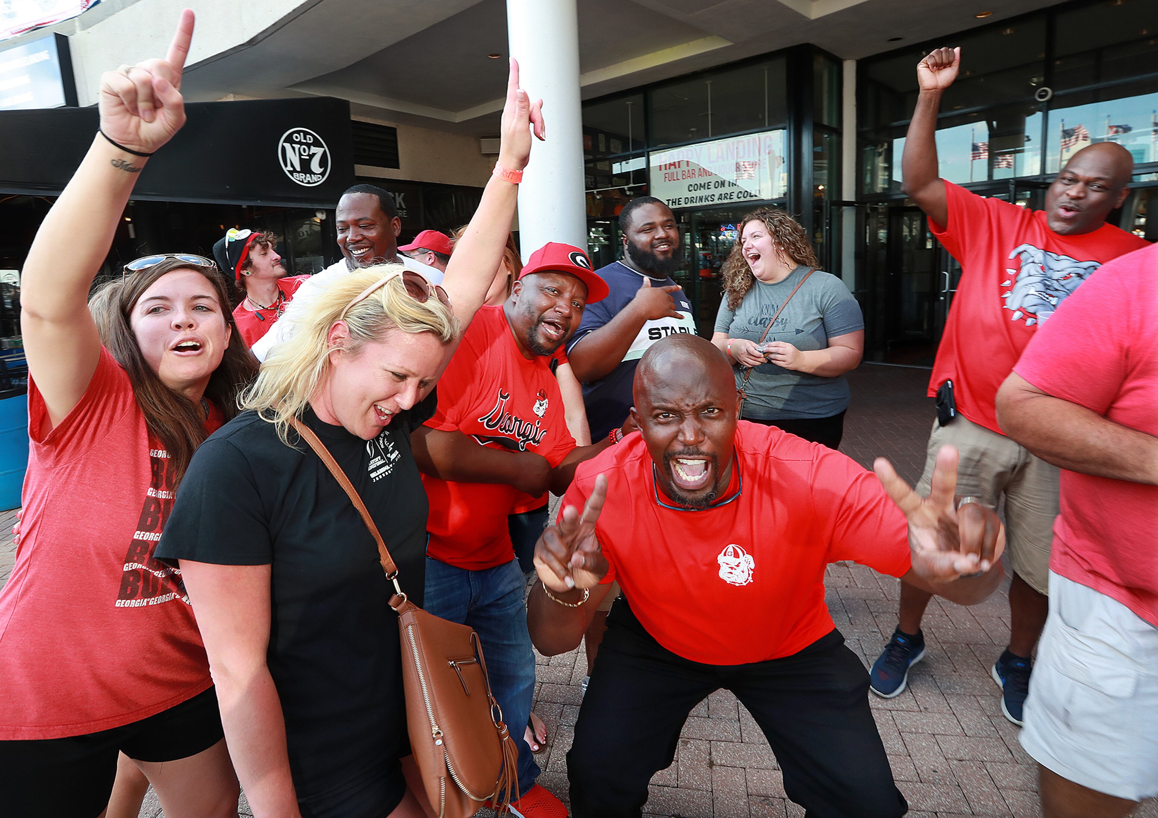 Georgia fans cheer for the Dawgs during the GA/FL Celebration at the Jacksonville Landing the night before the Georgia vs Florida NCAA college football game on Friday, Oct 26, 2018, in Jacksonville. Curtis Compton/ccompton@ajc.com