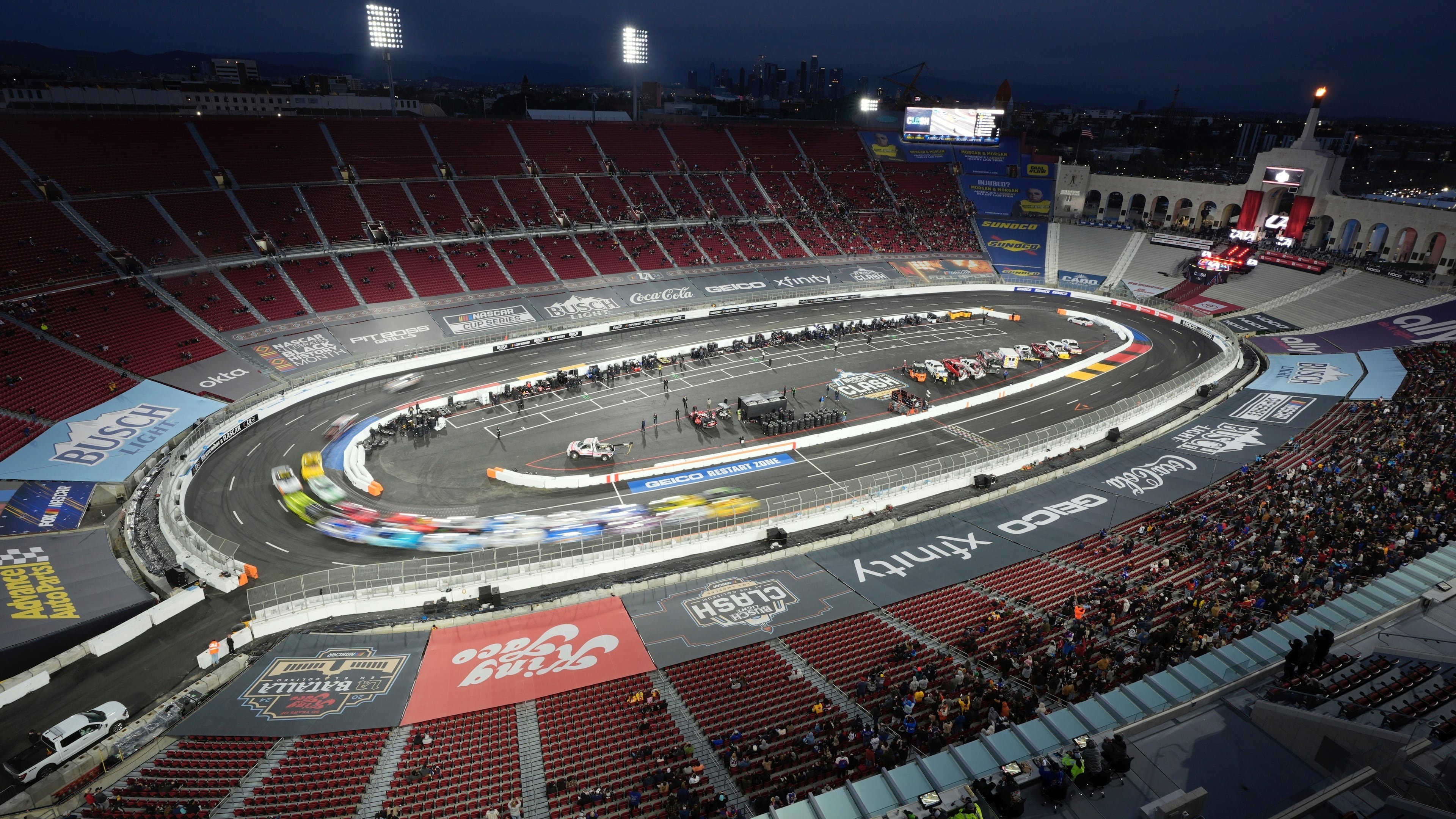 FILE - Cars race during the Busch Light Clash NASCAR exhibition auto race at Los Angeles Memorial Coliseum, Feb. 3, 2024, in Los Angeles. (AP Photo/Mark J. Terrill, File)