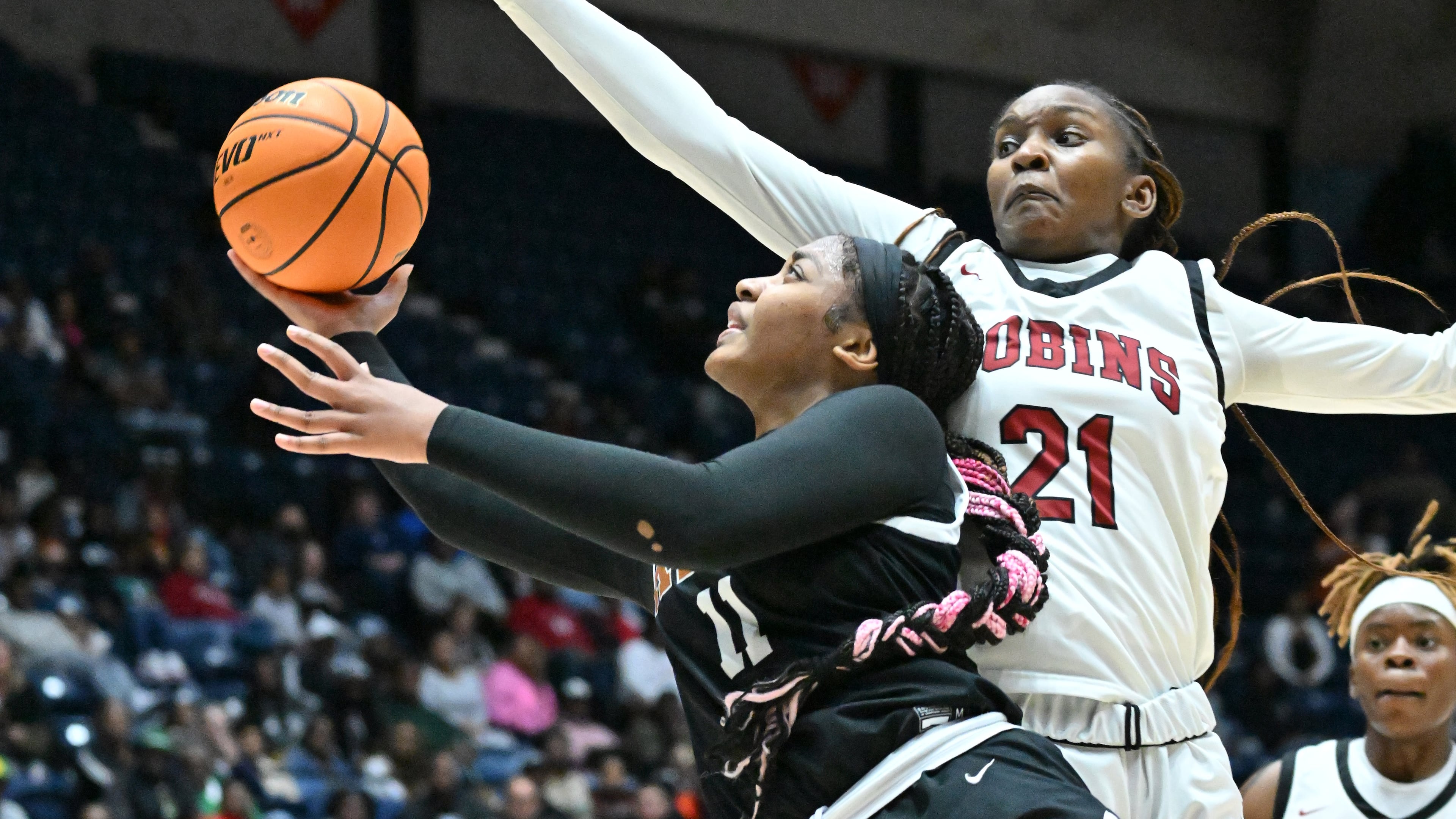 Kell’s Jada Green (11) goes in for a lay-up past Warner Robins' Kynnadi Howard (21) during 2023 GHSA Basketball Class 5A Girl’s State Championship game at the Macon Centreplex, Wednesday, March 8, 2023, in Macon, GA. (Hyosub Shin / Hyosub.Shin@ajc.com)