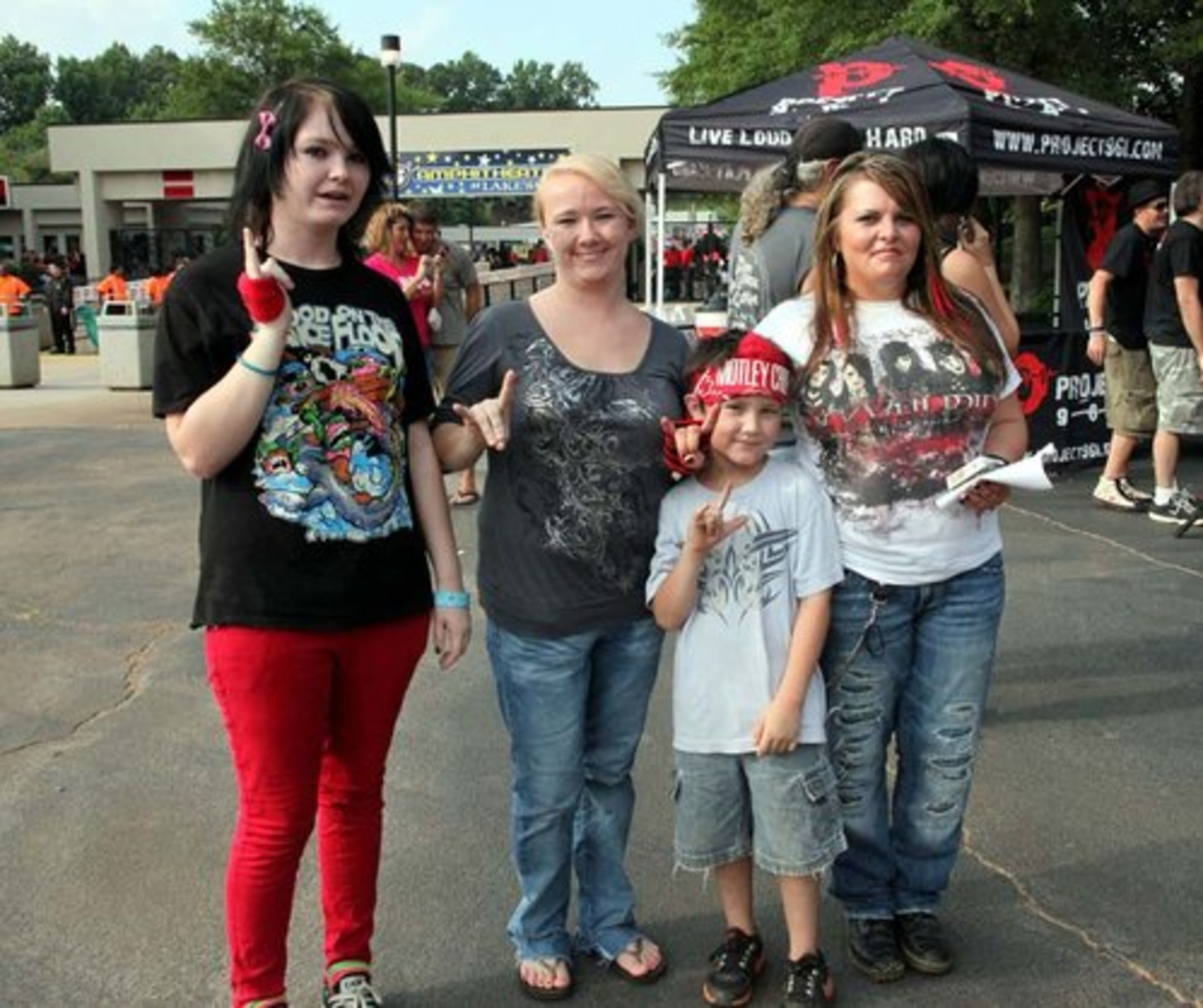 These Motley Crue fans from Slocomb, AL are, from left, Hagan and Tiffany Rodgers, Austin Martinez, and Melissa Herring.. This was 7-year old Austin's first concert experience.