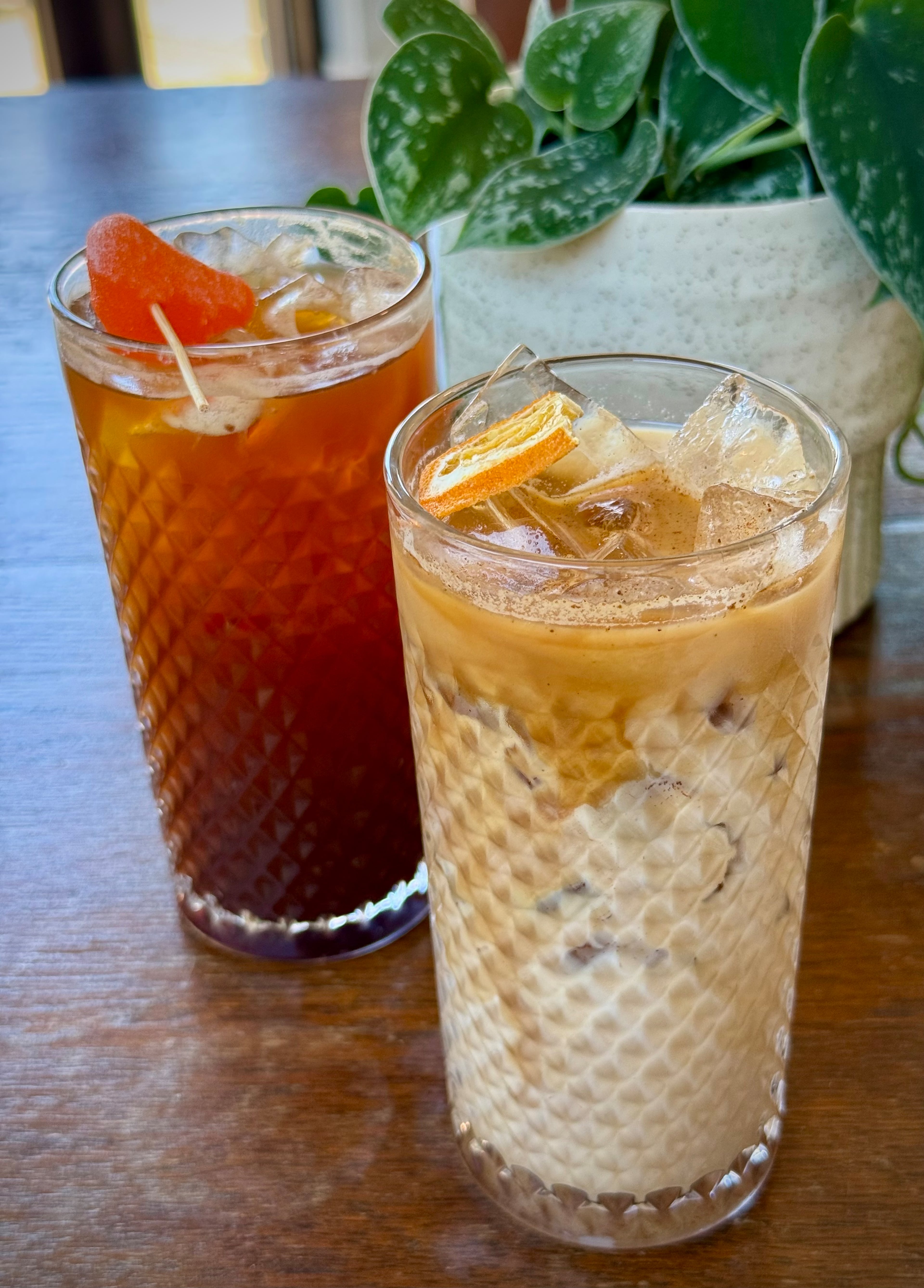 Two special summer coffee drinks from Stellow Coffee & Floral in Chamblee: Betty's Fresca soda (left) and Sammie's sunrise over ice. (Henri Hollis/AJC)