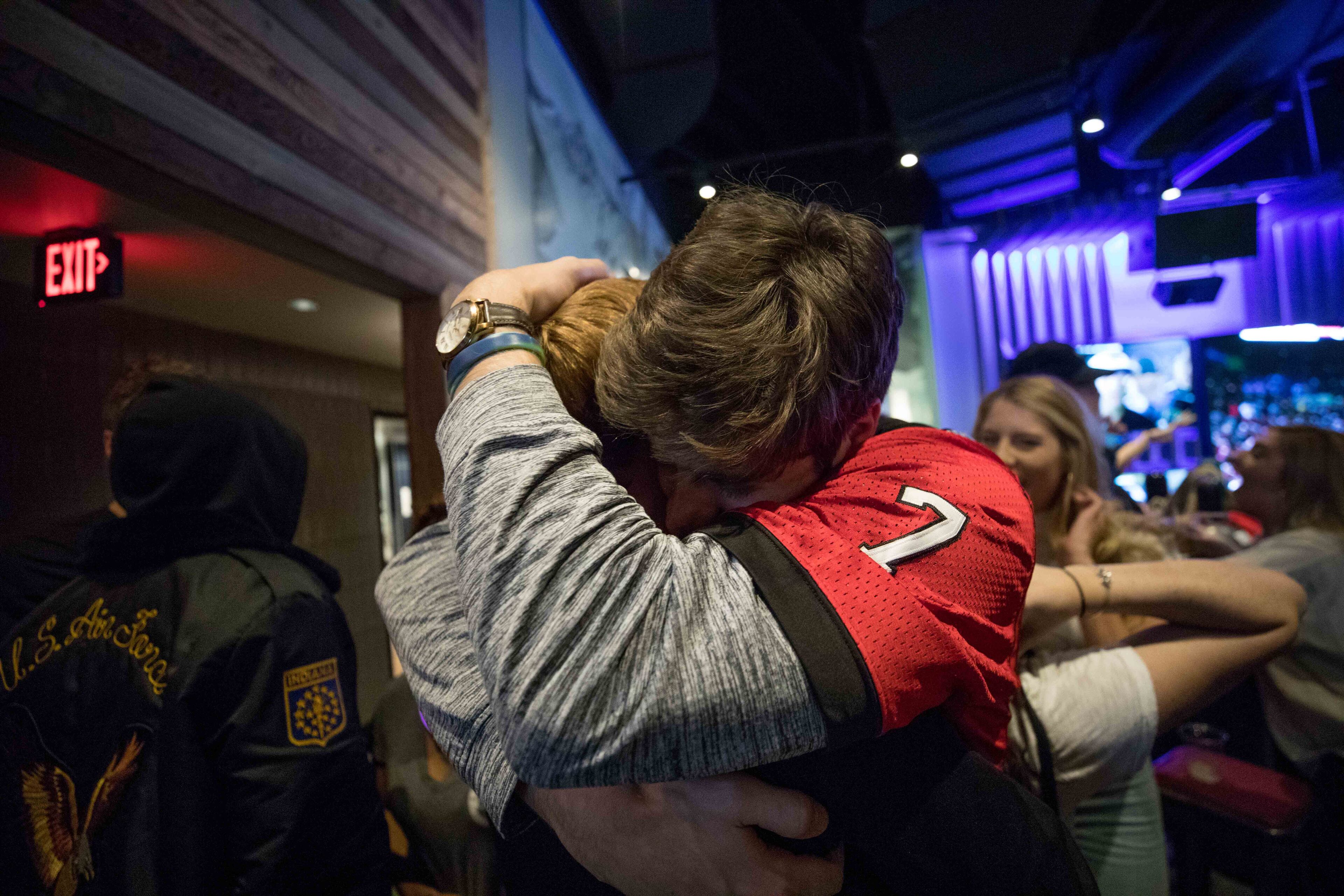 Fans react after Georgia defeated Oklahoma in double overtime to win the Rose Bowl NCAA college football game, Monday, Jan. 1, 2018, in Atlanta. BRANDEN CAMP/SPECIAL