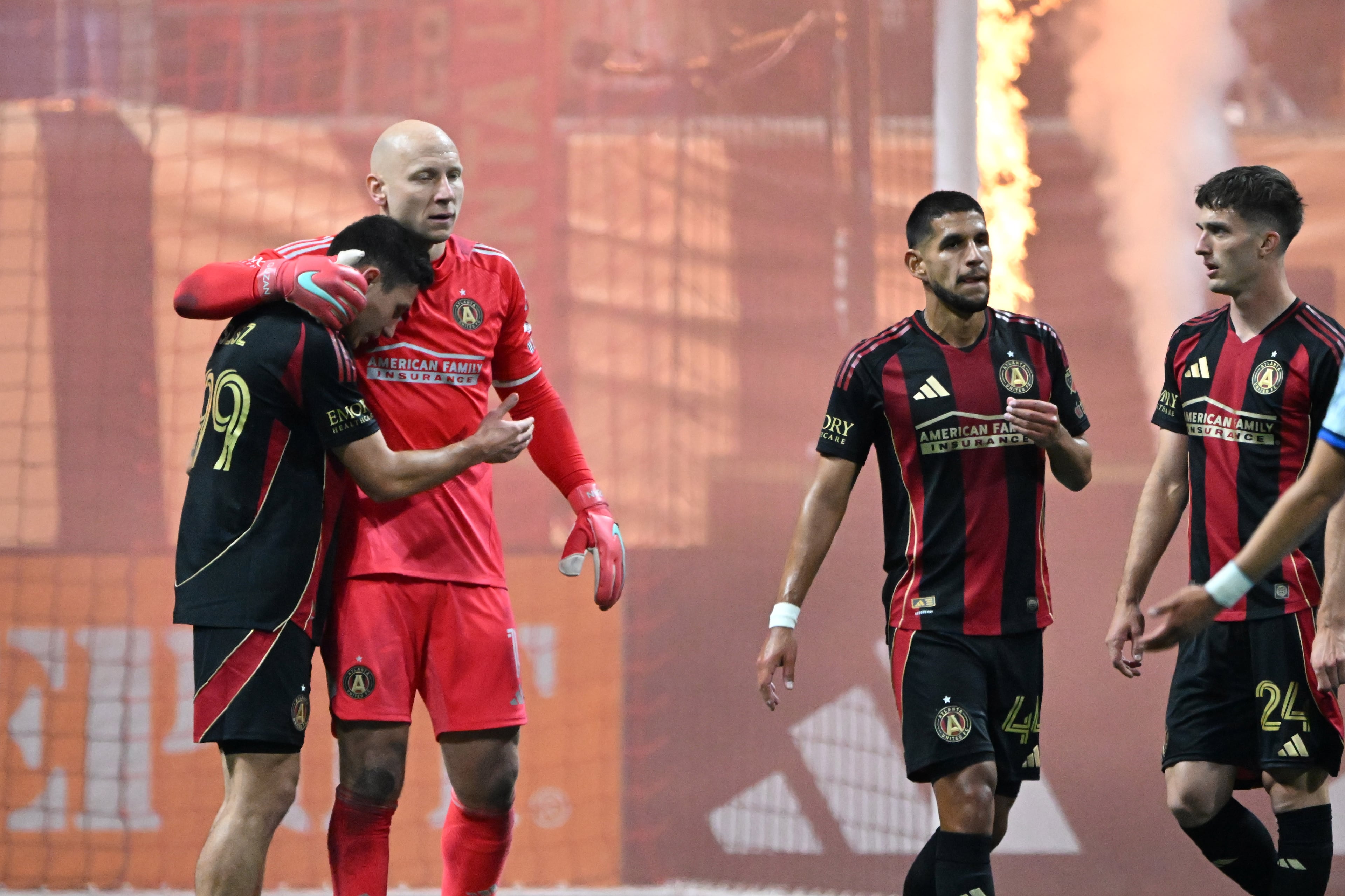 Atlanta United players celebrate at the end of the second half of Atlanta United’s MLS season opener at Mercedes-Benz Stadium, Saturday, February 22, 2025, in Atlanta. Atlanta United won 3-2 over CF Montreal. (Hyosub Shin / AJC)