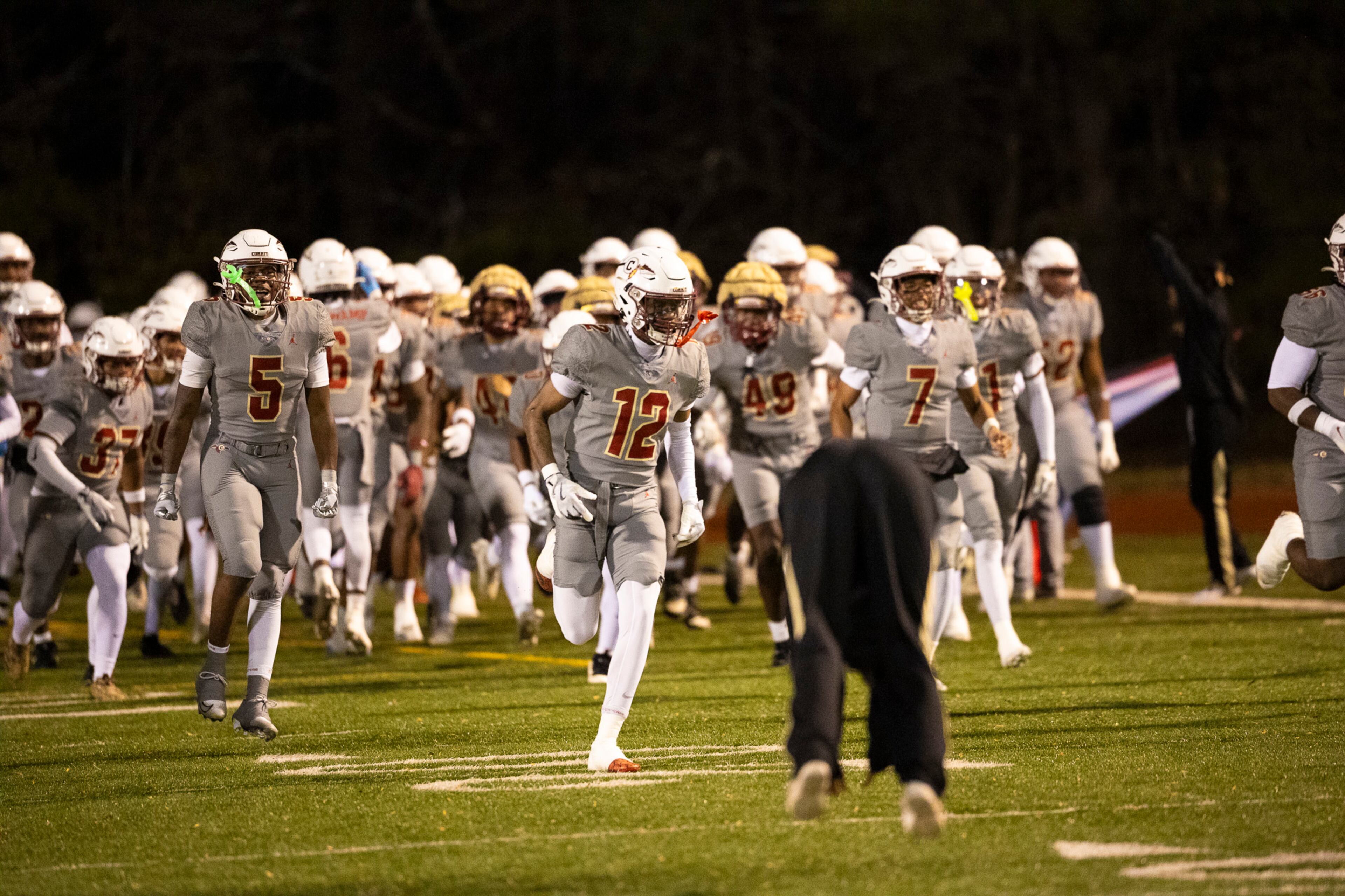 Creekside players run out during their Class 4A semifinal against Kell on Friday, Dec. 5, 2025, at Creekside High School in Fairburn. (Oscar Guevara Saenz for the AJC)
