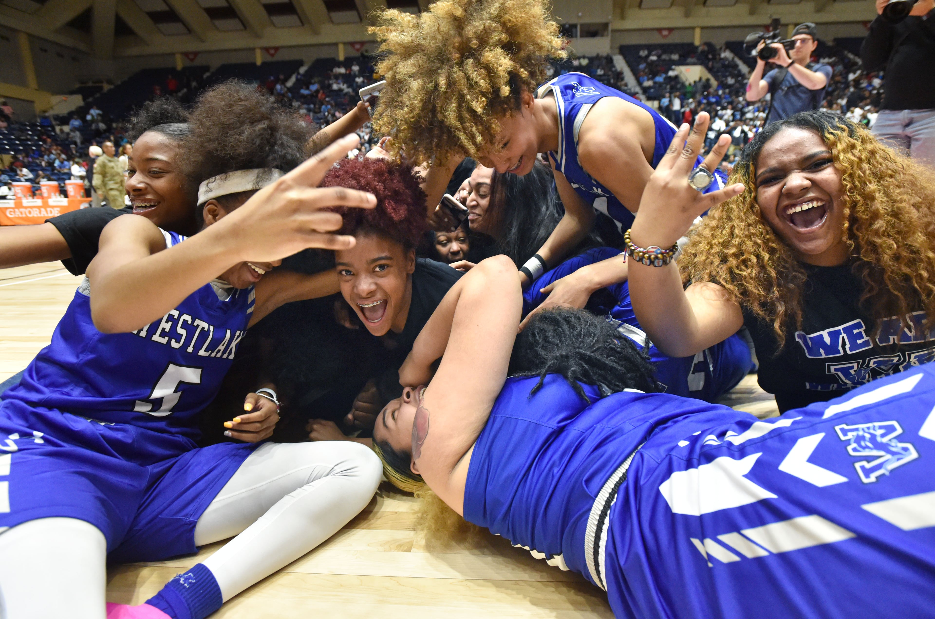 March 9, 2019 Macon - Westlake players celebrate their victory in GHSA State Basketball Championship game at the Macon Centreplex in Macon on Saturday, March 9, 2019. Westlake won 60-53 over the Collins Hill. HYOSUB SHIN / HSHIN@AJC.COM