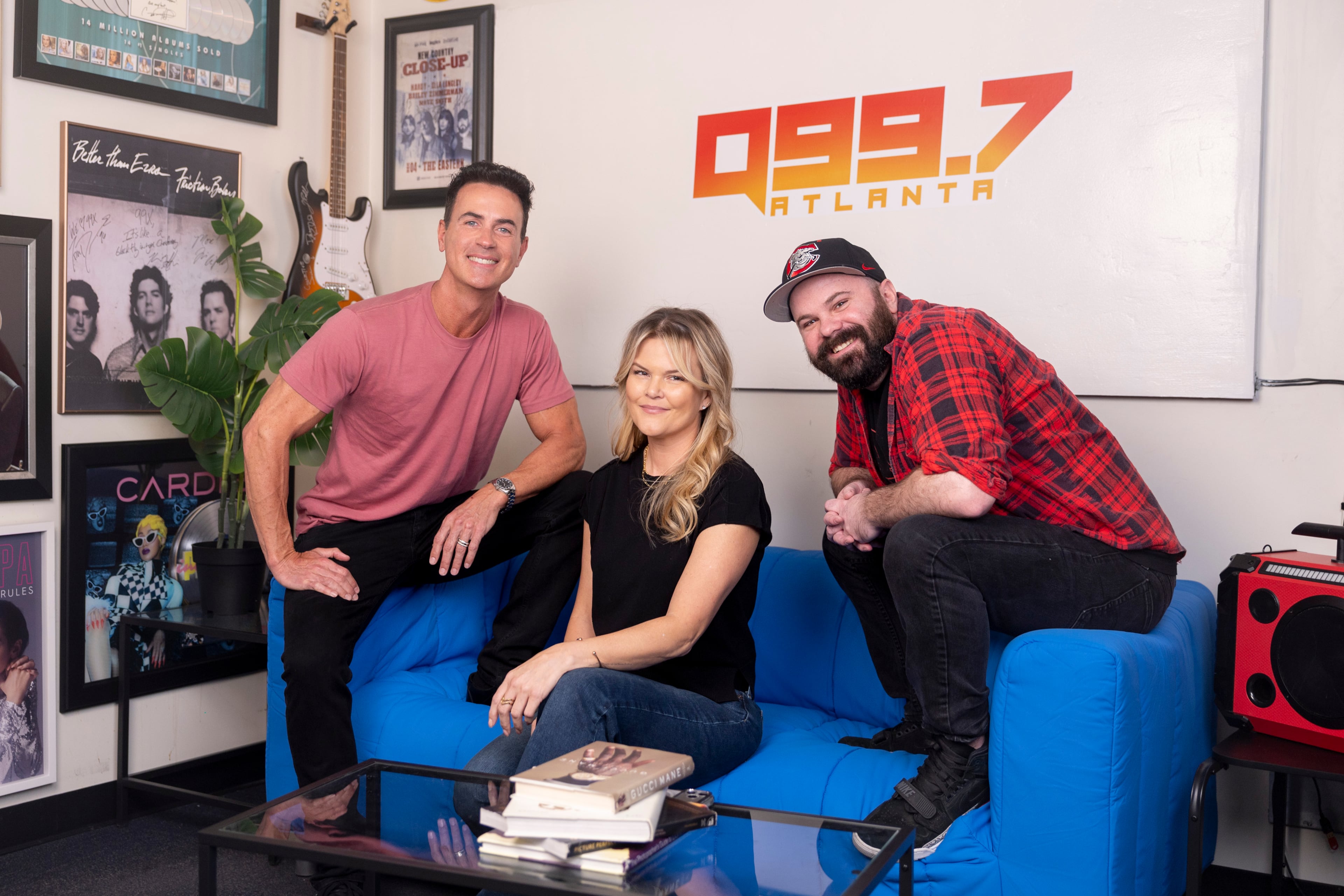 Joe Breezy, DK Kramer and Cory Freeman pose for a portrait at Q99.7 in Atlanta on Wednesday, March 25, 2026. Q99.7 is replacing The Bert Show of 25 years with a new trio. (Arvin Temkar/AJC)