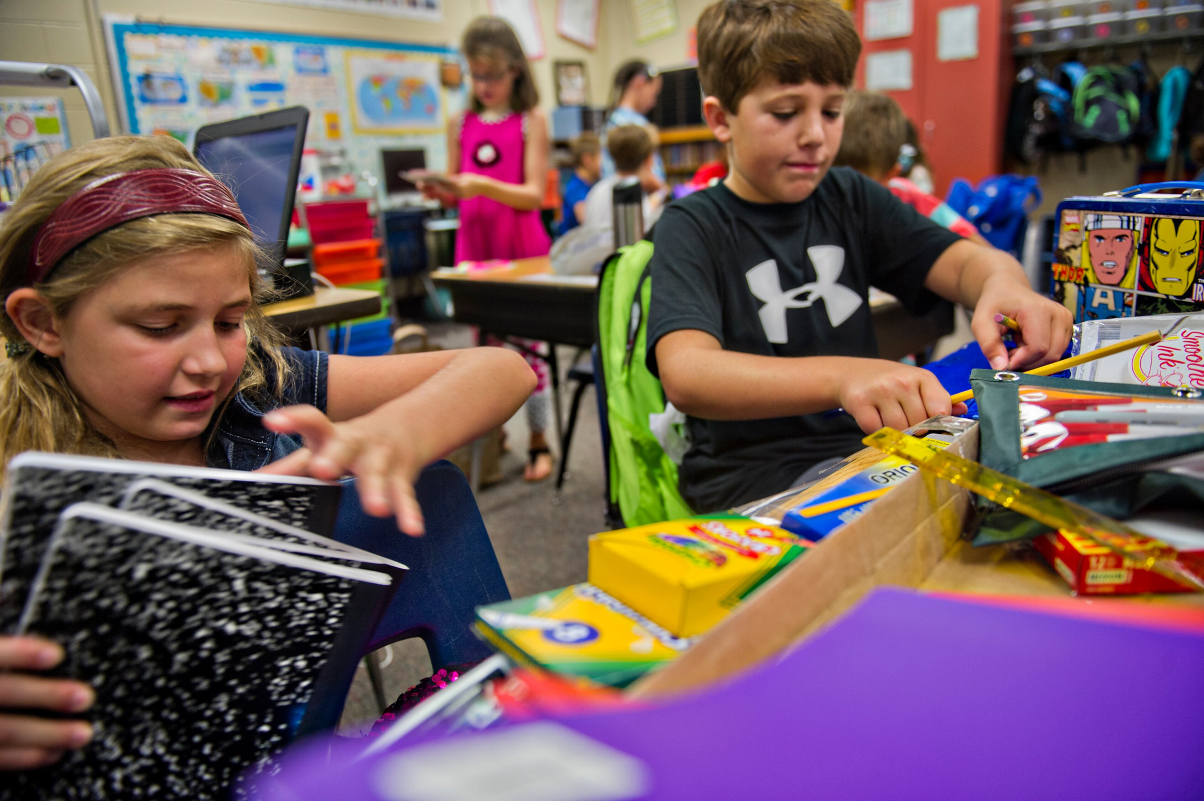 Leah Perry (left) and Alex Brantley organize their supplies during the first day of classes at Davis Elementary School in Marietta on Monday, August 4, 2014. Teachers and administrators at the school dressed as pirates for the first day of school. Students in Cobb County and Atlanta public schools headed back to class on Monday for the new school year. JONATHAN PHILLIPS / SPECIAL
