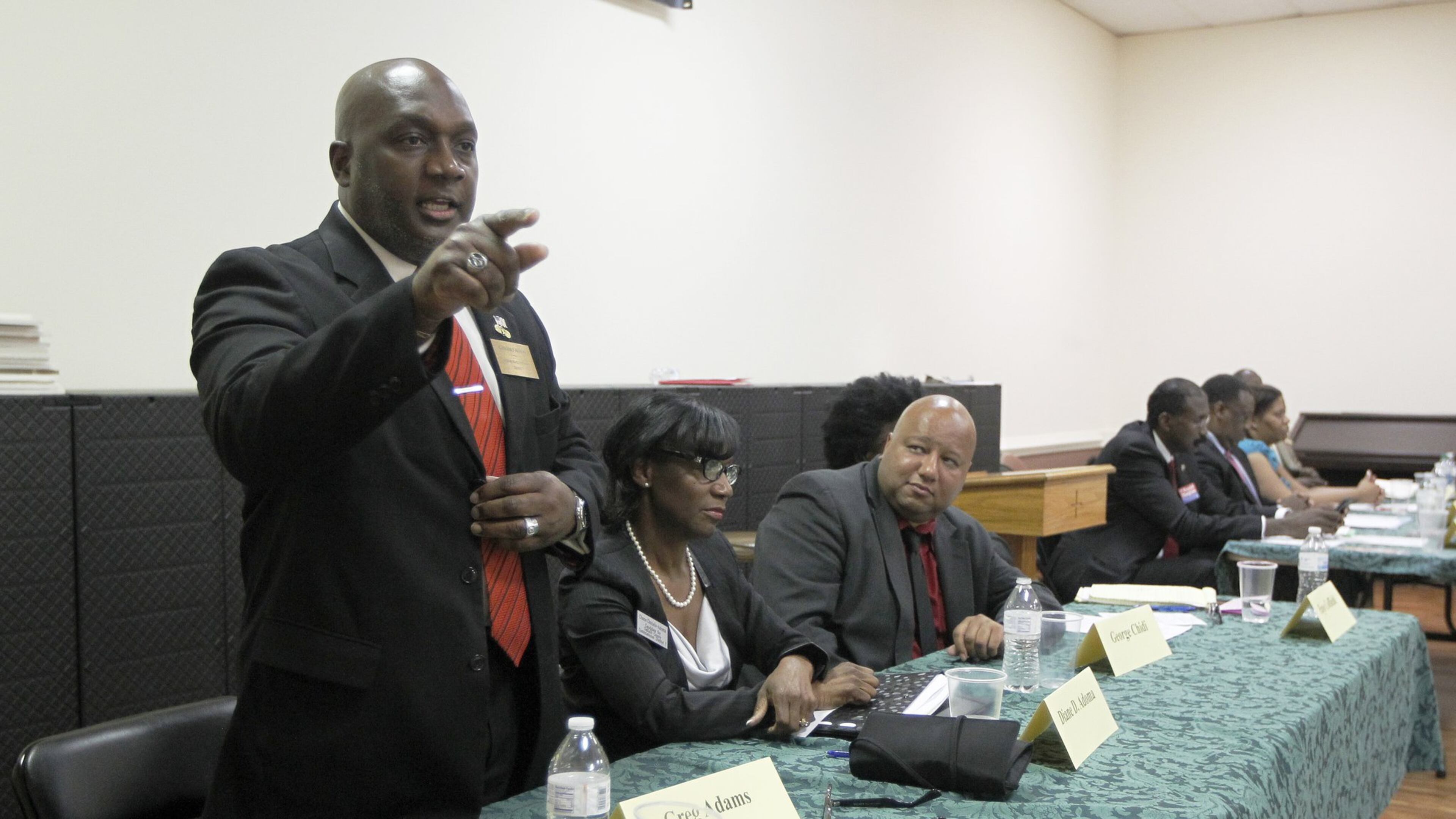 Eight candidates for DeKalb County Commission District 7 spoke with voters during a forum at St. Timothy United Methodist Church on Thursday. From left: Greg Adams, Diane Adoma, George Chidi, Faye Coffield, Randal Mangham, Ed Patton, Rita Robinzine, John Tolbert. TAMI CHAPPELL / SPECIAL TO THE AJC