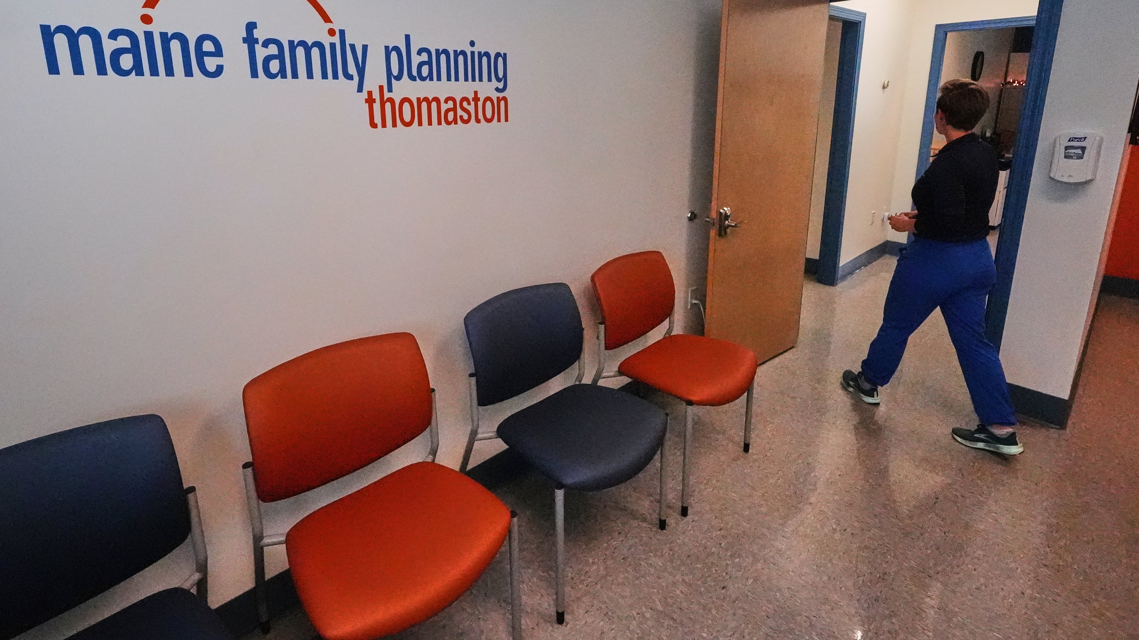 FILE - Vanessa Shields-Haas, a nurse practitioner, walks from the lobby toward the examination rooms at the Maine Family Planning healthcare facility, July 15, 2025, in Thomaston, Maine. (AP Photo/Charles Krupa, File)