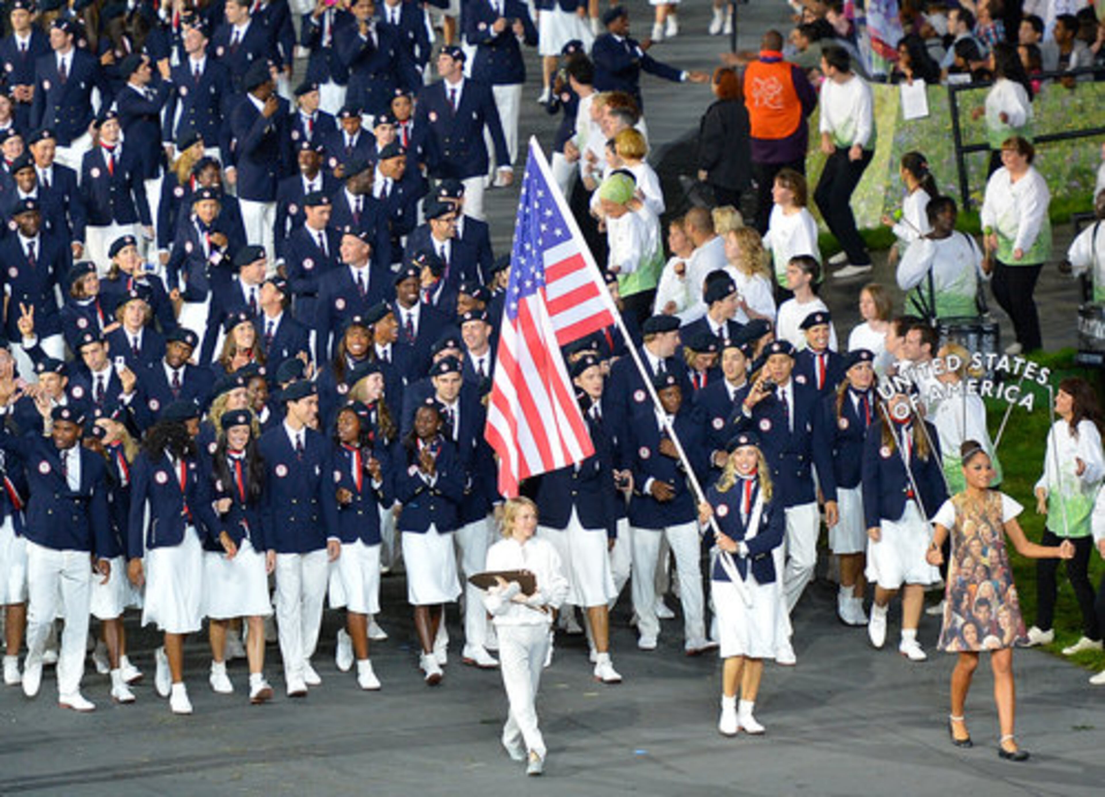 The United States Olympic team led by flag bearer and fencer Mariel Zagunis marches into the stadium during the Opening Ceremony for the London 2012 Summer Olympic Games at the Olympic Stadium.2012.