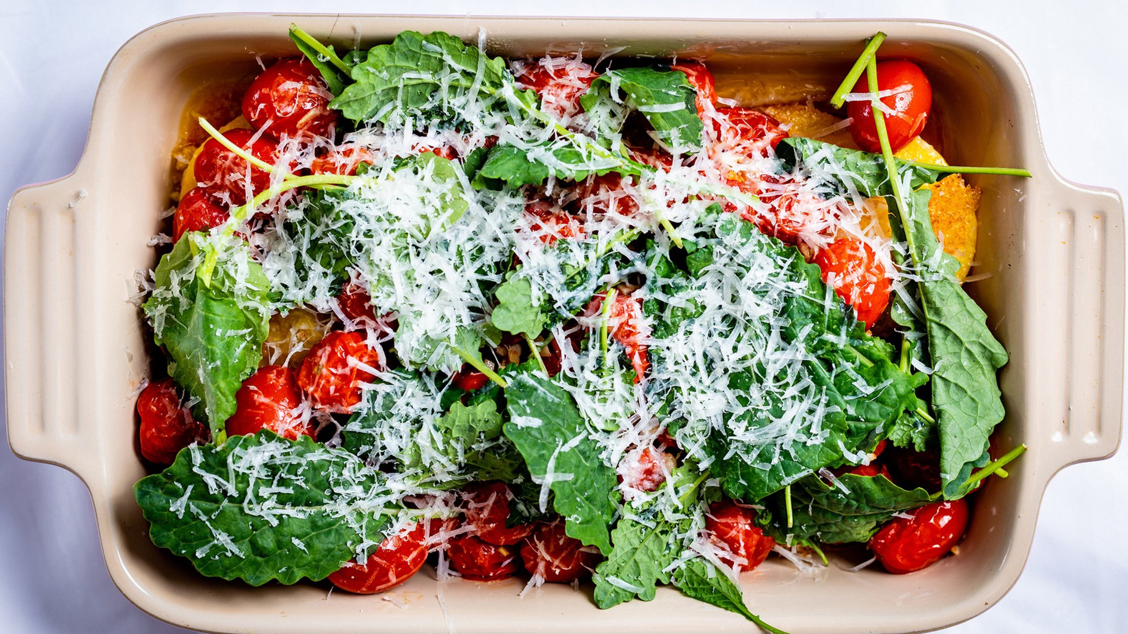 Our recipe for Polenta with Cherry Tomatoes uses freshly grated Parmesan cheese and arugula (or baby kale, fresh parsley or fresh basil). CONTRIBUTED BY HENRI HOLLIS