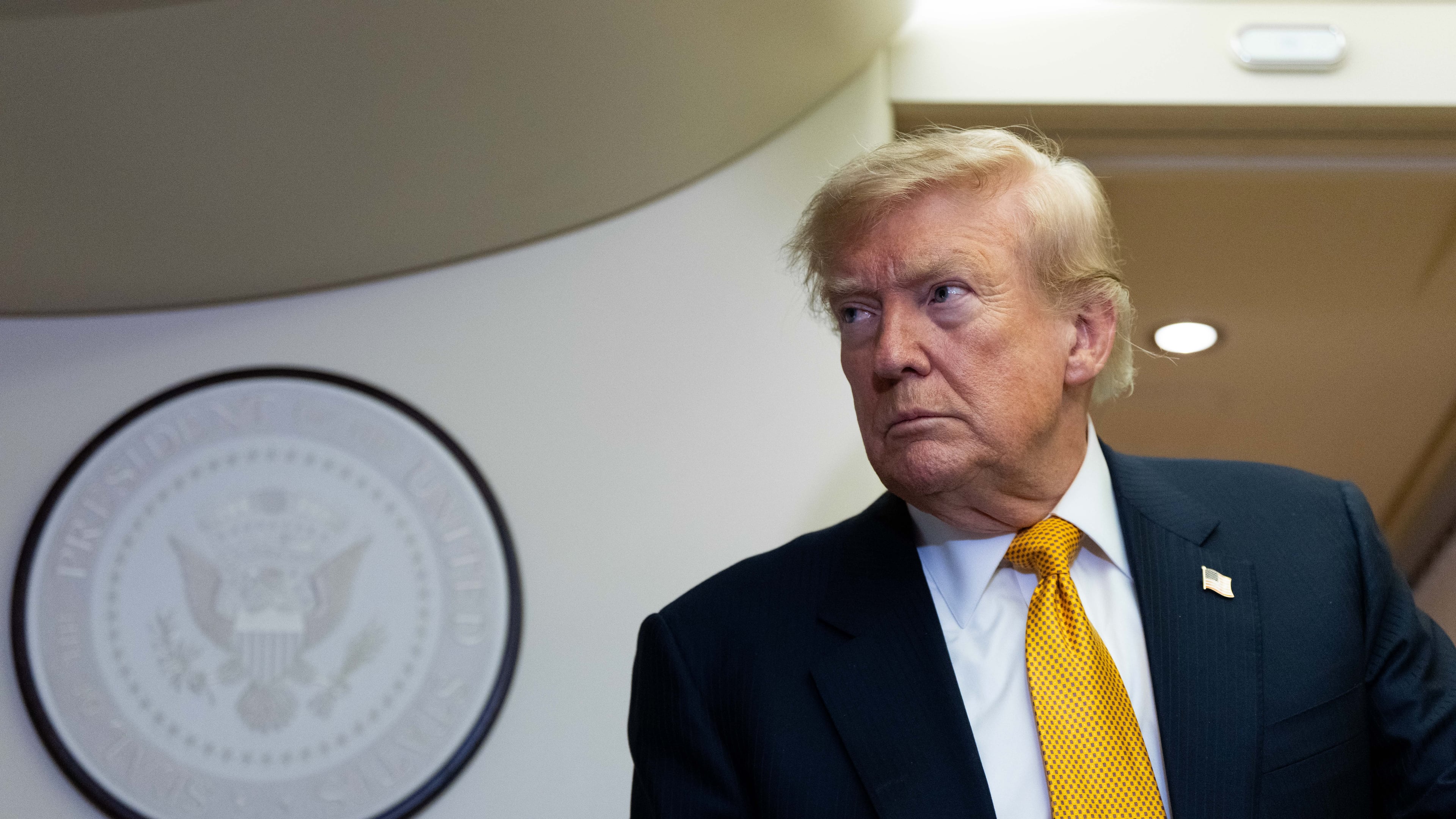 President Donald Trump speaks with reporters in flight on Air Force One after landing at U.S. Air Force Base at RAF Mildenhall, in Suffolk, Eastern England, Wednesday, July 8, 2026. (AP Photo/Alex Brandon)
