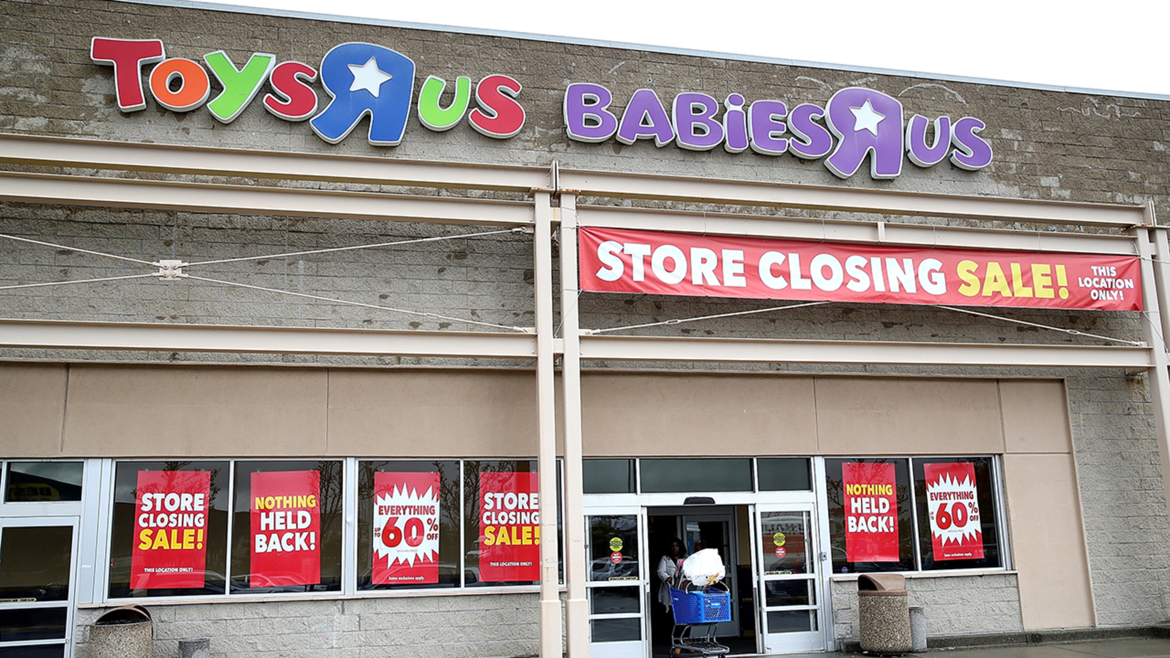 A customer leaves a Toys R Us store on March 15, 2018 in Emeryville, California. Toys R Us reportedly rejected a $675 million bid for the stores for being too low. (Photo by Justin Sullivan/Getty Images)