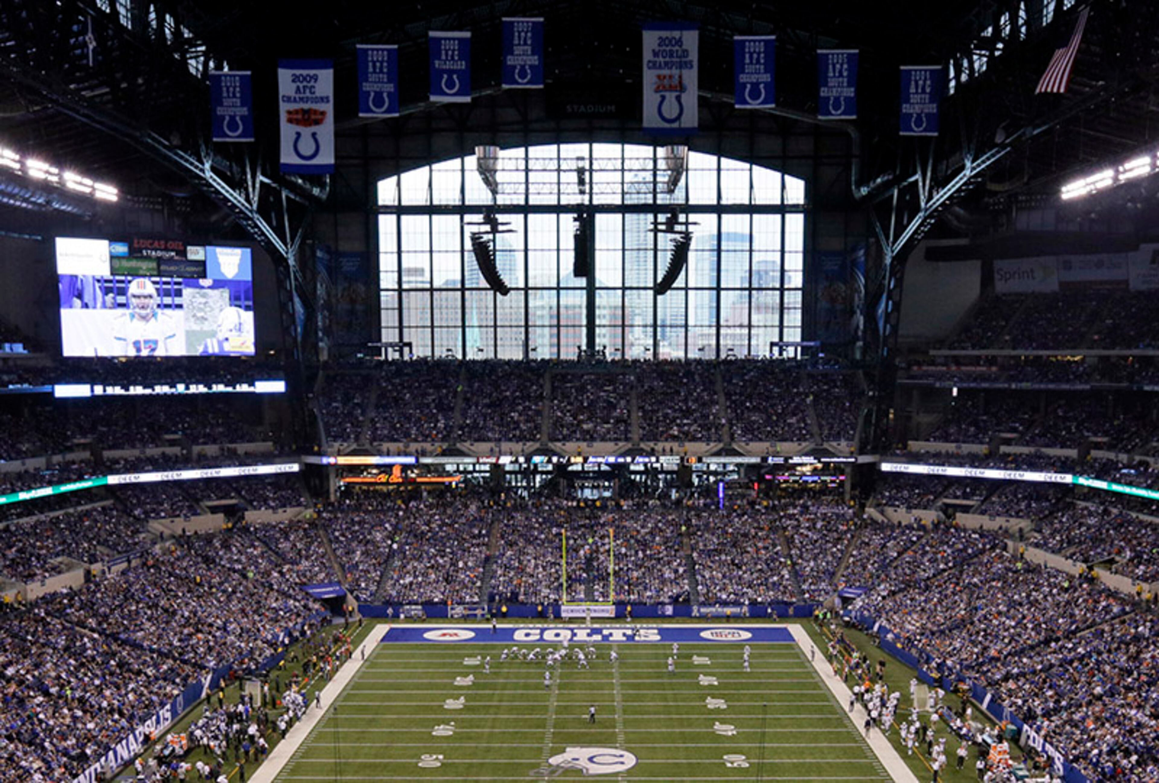 The Indianapolis Colts play the Miami Dolphins during the second half of a game in Indianapolis. Opened in 2008, the stadium's giant front window offers a view of the city skyline.