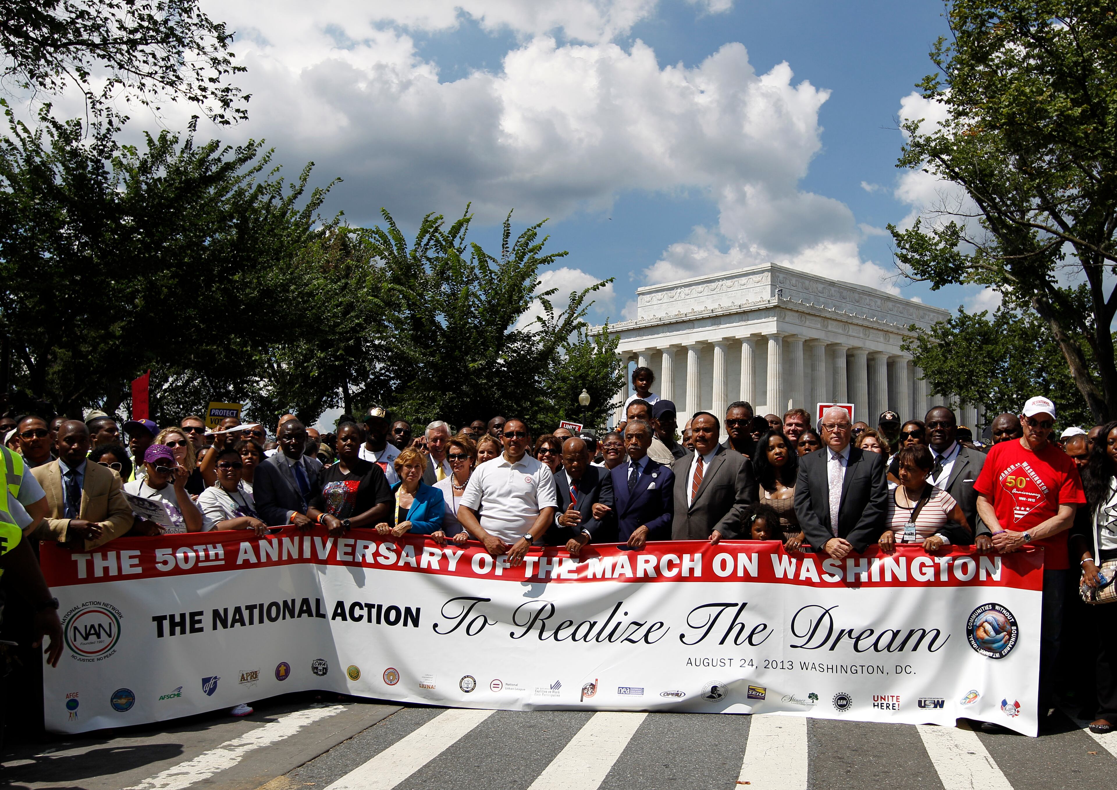 House Minority Leader Nancy Pelosi of Calif., Rev. Al Sharpton, Martin Luther King, III, Congressman John Lewis, Bernice King, Adreienne King, Washington City Mayor Vincent C. Gray among others start the march at Lincoln Memorial during the rally to commemorate the 50th anniversary of the 1963 March on Washington at the Lincoln Memorial in Washington, Saturday, Aug. 24, 2013. Fifty years ago on August 28, 1963, the Rev. Martin Luther King Jr. spoke his "I Have a Dream" speech during the March on Washington. (AP Photo/Jose Luis Magana)