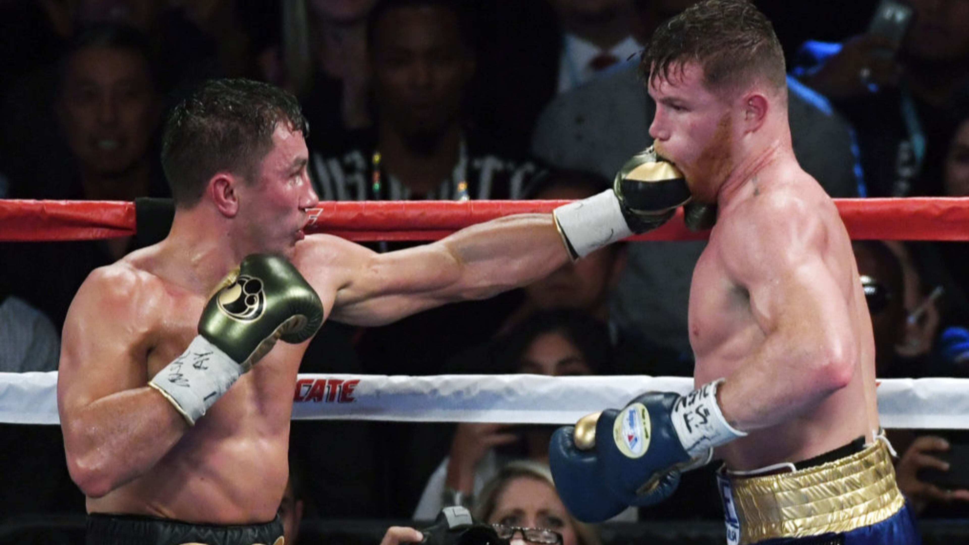 Gennady Golovkin (left)connects against Canelo Alvarez during the 12th round of their WBC, WBA and IBF middleweight championship bout .