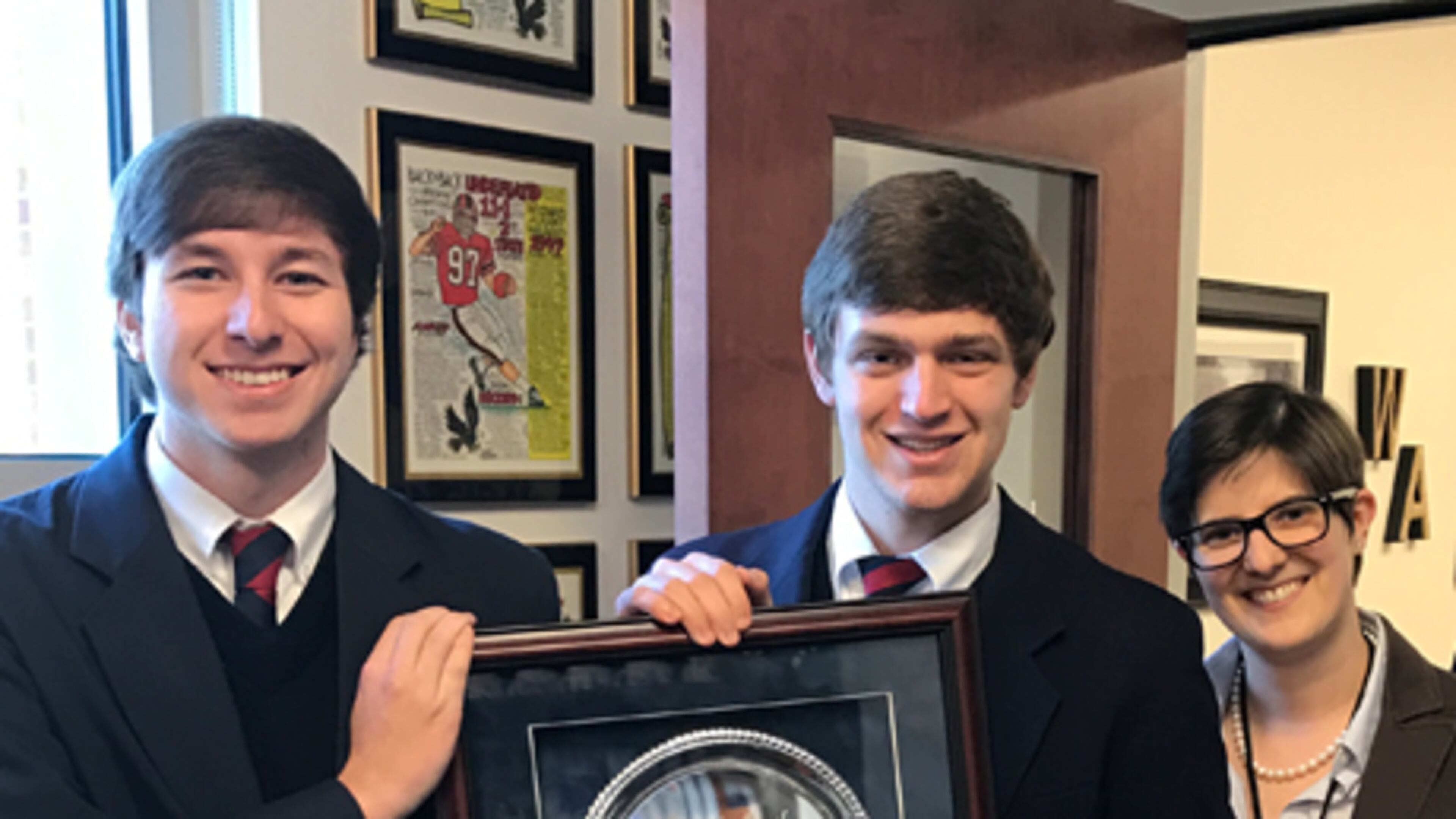 Tripp Haskins, left, Max Abramson and Woodward Academy debate director Maggie Barthiaume.