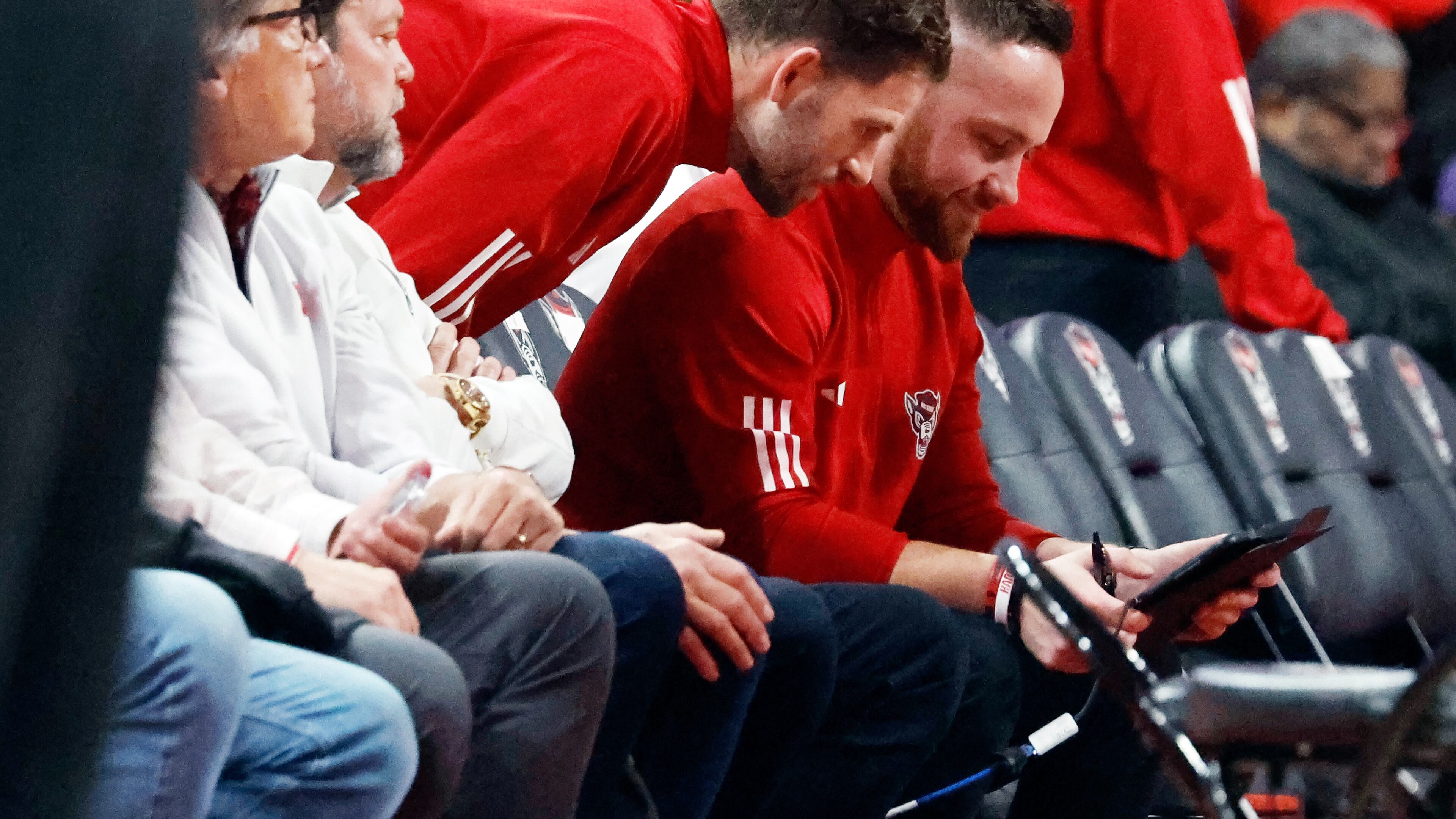 North Carolina States' Reed Vial, left, and Patrick Stacy, center, watch a replay during the first half of an NCAA college basketball game against Duke in Raleigh, N.C., Monday, March 2, 2026. (AP Photo/Karl DeBlaker)