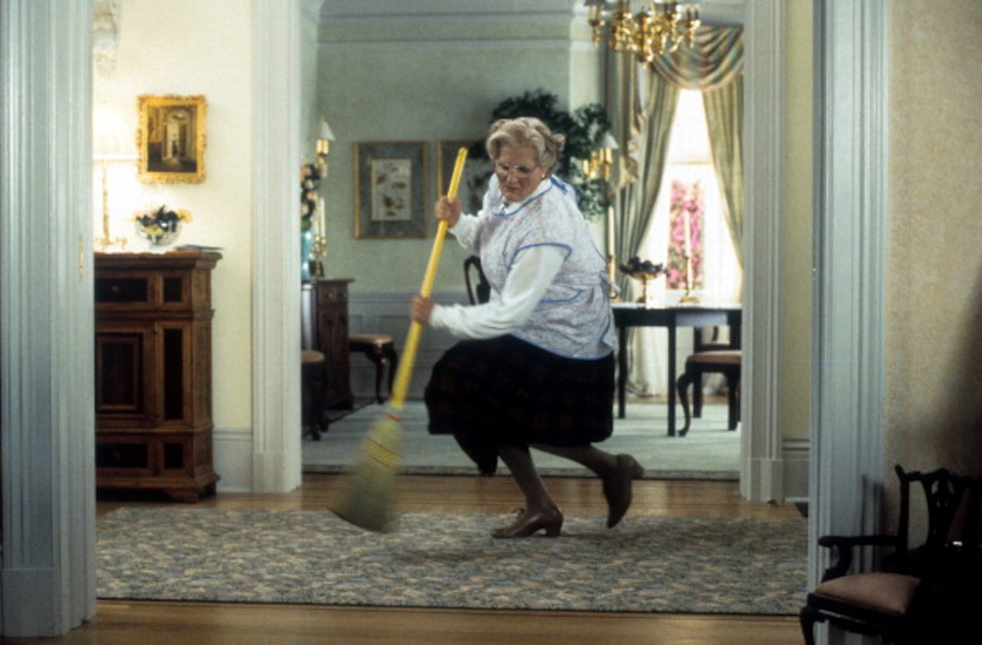 Robin Williams brooms in a scene from the film 'Mrs. Doubtfire', 1993. (Photo by 20th Century-Fox/Getty Images)