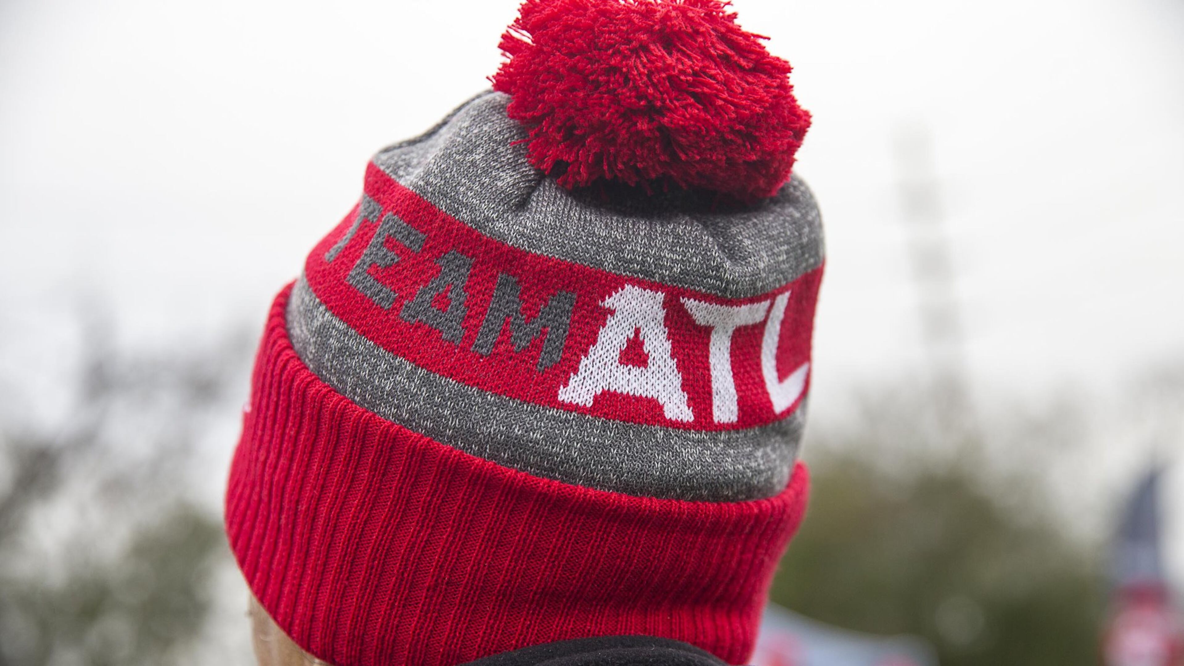 A volunteer with the Atlanta Super Bowl Host Committee wears her “Team ATL” branded hat during an urban forestry project at the Salvation Army Bellwood Boys and Girls Club in Atlanta’s English Avenue community earlier this month. ALYSSA POINTER / ALYSSA.POINTER@AJC.COM