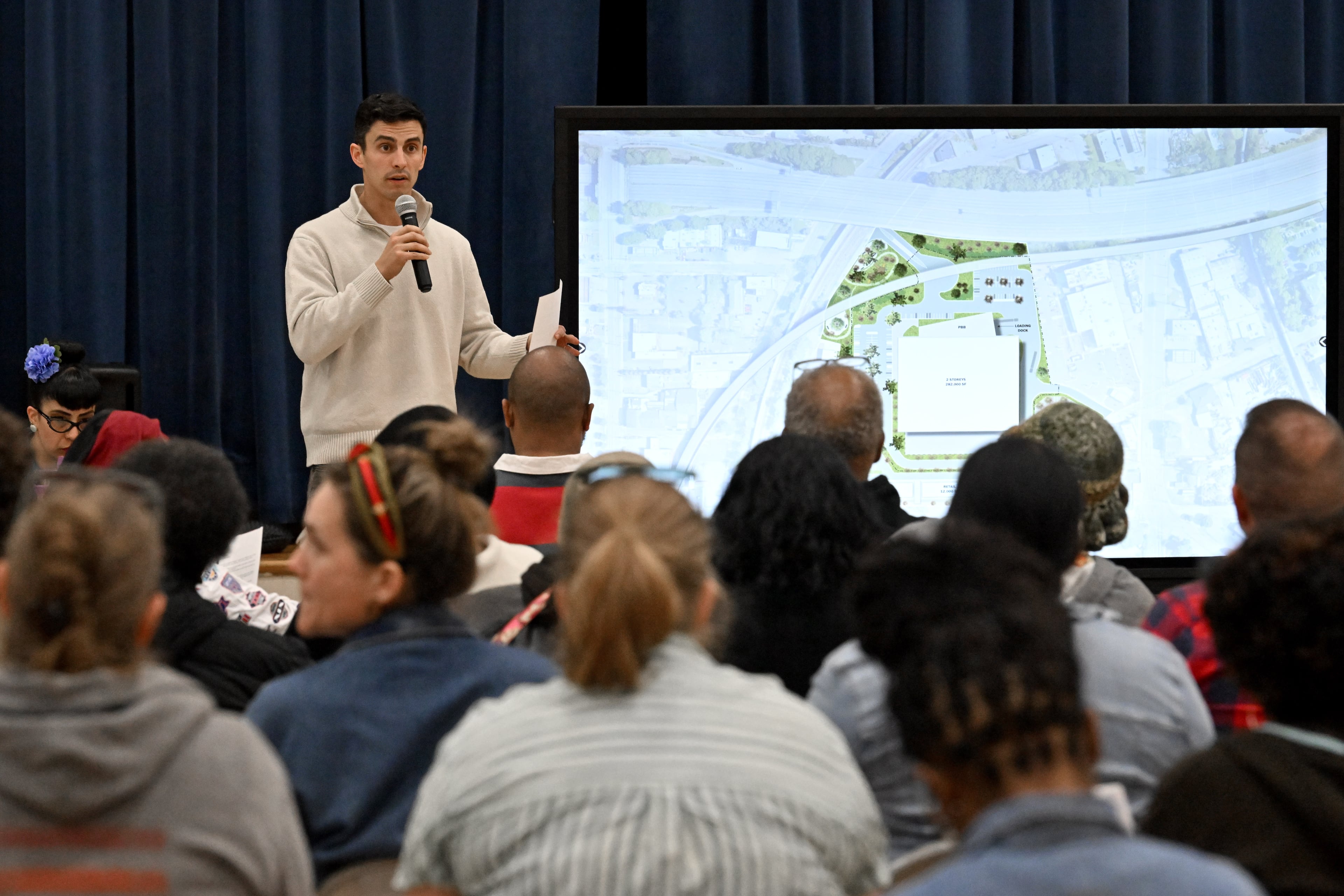 Andrew Alves, Digital Realty's senior vice president of acquisitions, speaks during a town hall by NPU-V and Digital Realty to discuss a planned data center in Atlanta at Dunbar Elementary School, Thursday, March 19, 2026, in Atlanta. (Hyosub Shin/AJC)