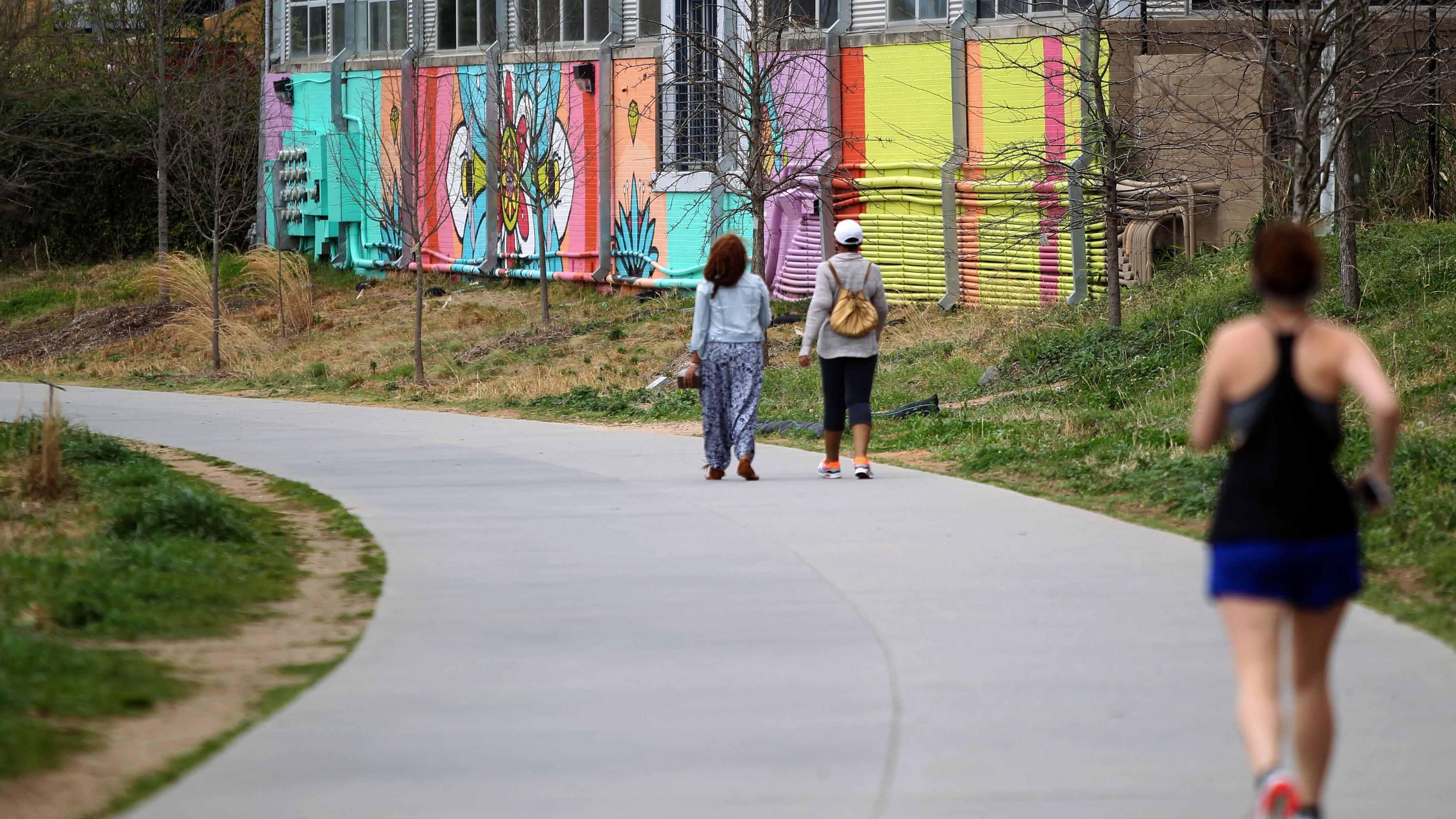 Pedestrians walk along part of the Eastside Trail on the Atlanta Beltline