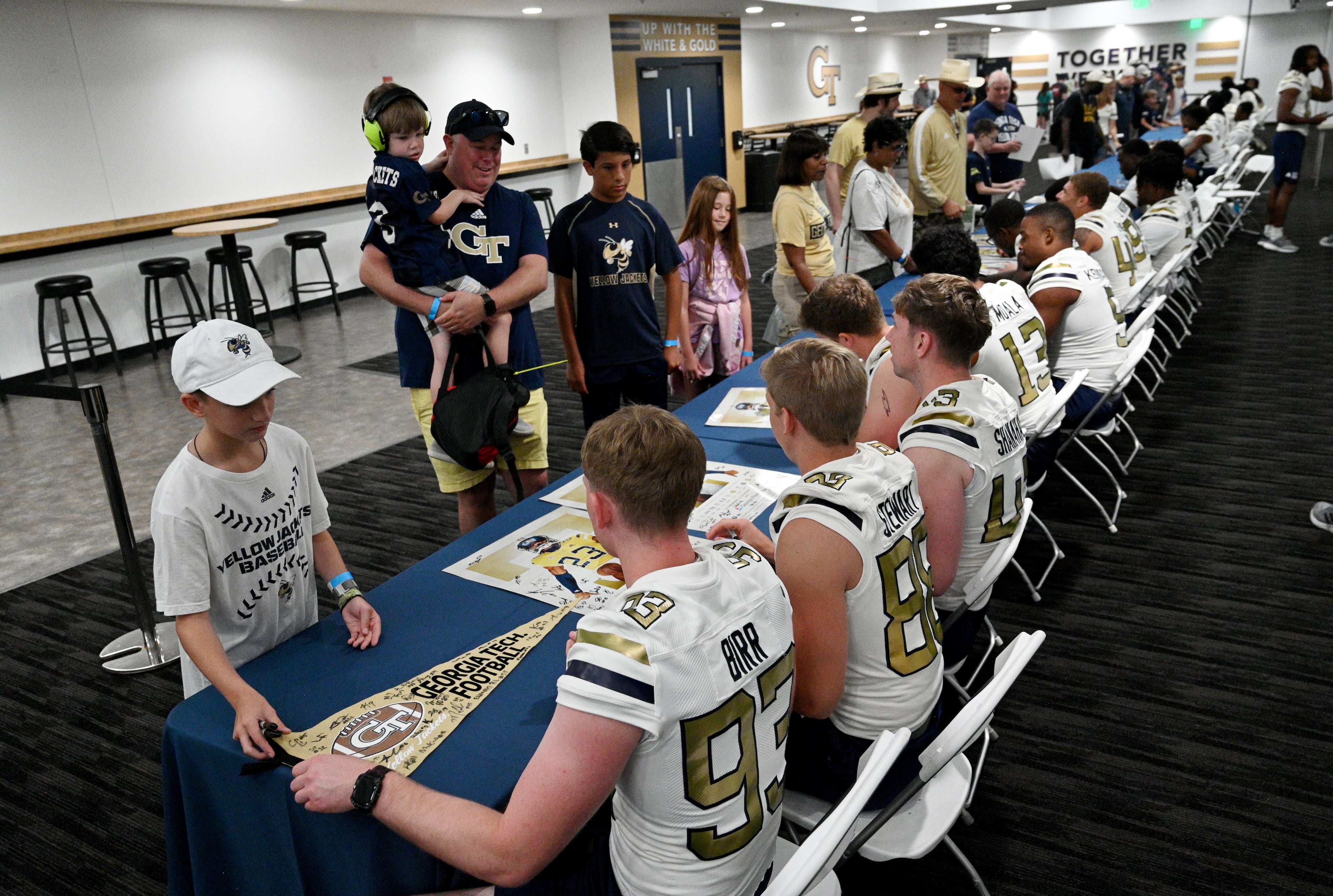 Georgia Tech players sign autographs for fans at Bobby Dodd Stadium. (Hyosub Shin / Hyosub.Shin@ajc.com)