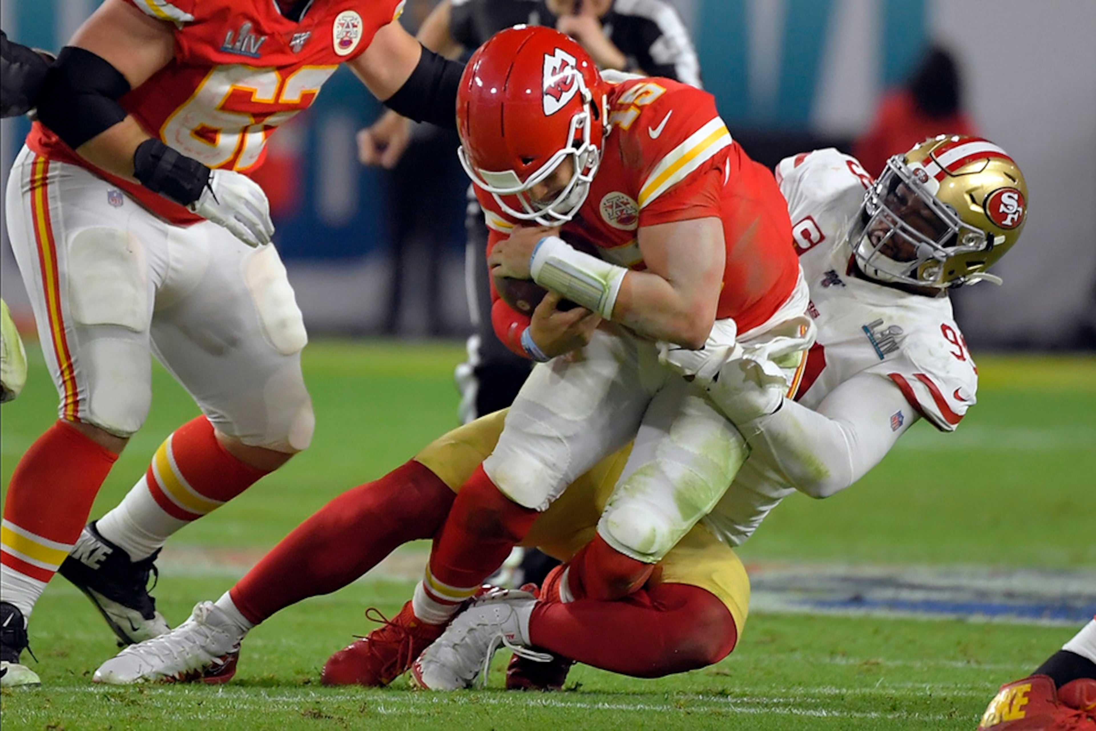 San Francisco 49ers' DeForest Buckner (right) sacks Kansas City Chiefs' quarterback Patrick Mahomes during the second half of Super Bowl 54 Sunday, Feb. 2, 2020, in Miami Gardens, Fla.