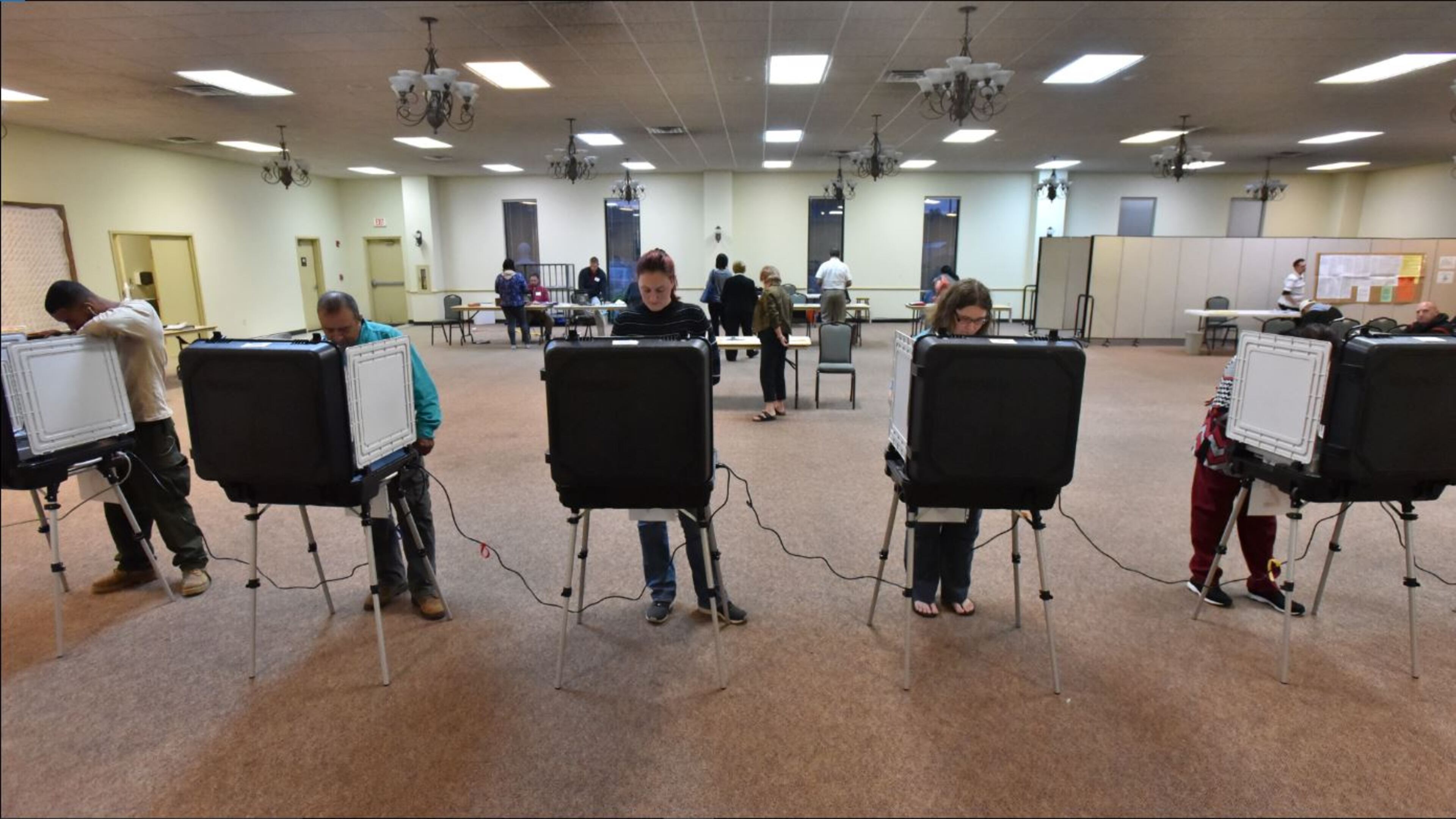 Gwinnett County residents cast their votes in the 2016 presidential election at First Baptist Church of Lilburn. HYOSUB SHIN / HSHIN@AJC.COM