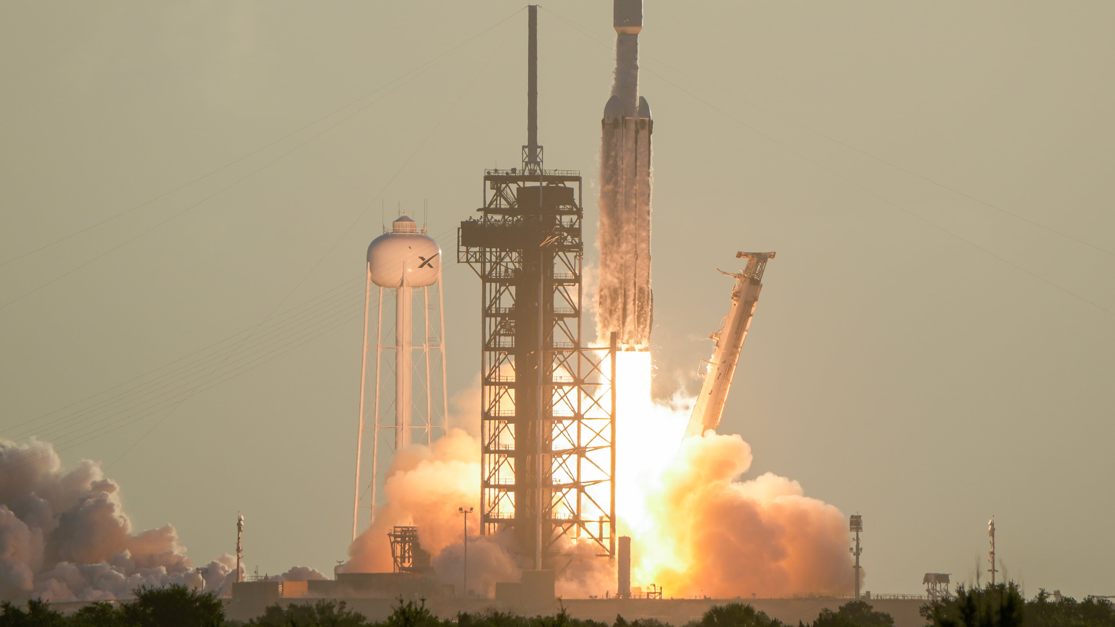 A SpaceX Falcon Heavy rocket with the space observatory Roman Telescope lifts off from launch complex 39A at the Kennedy Space Center in Cape Canaveral, Fla., Sunday, Aug. 30, 2026. (AP Photo/John Raoux)