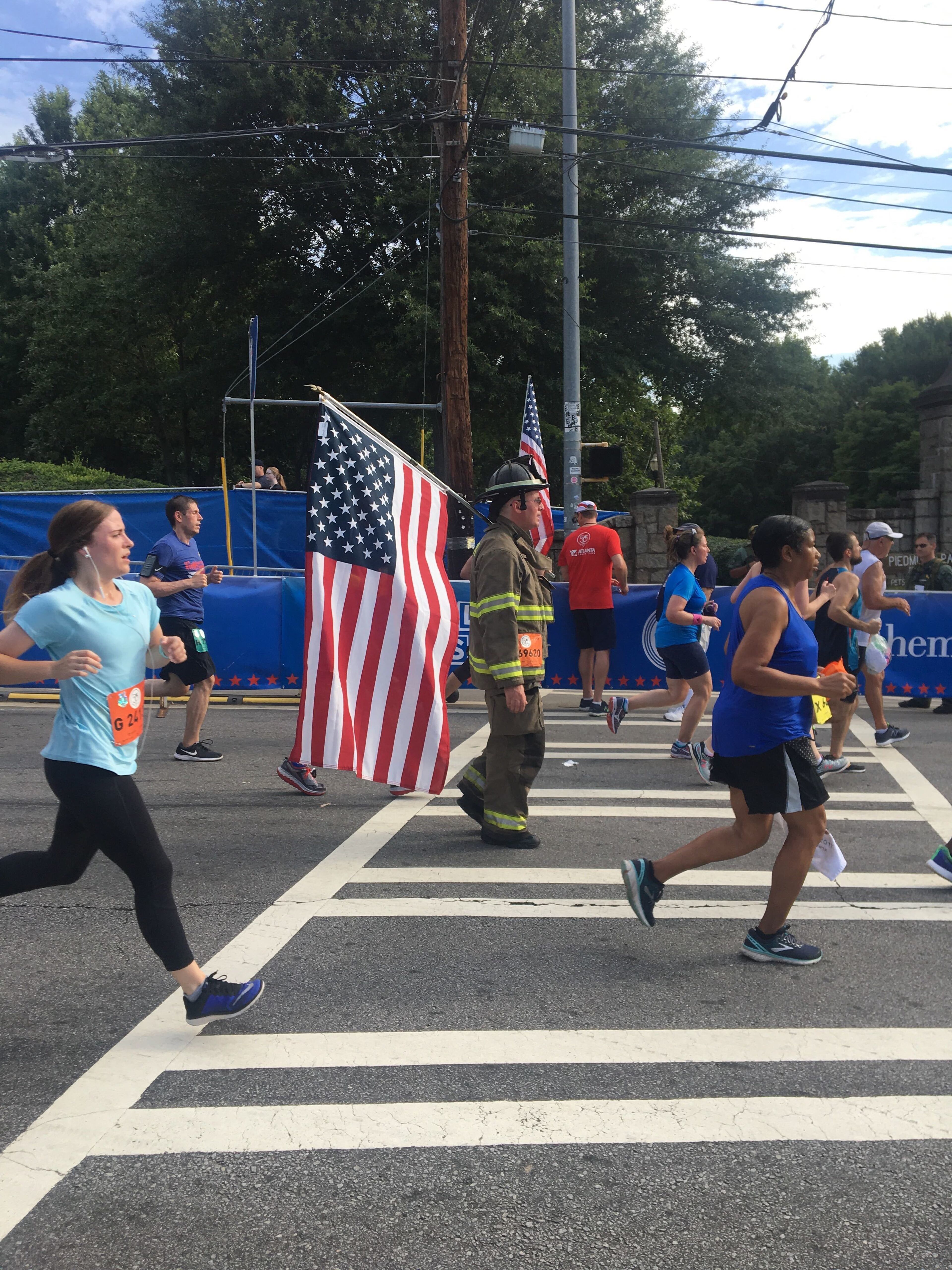 One participant dressed in firefighter garb during the AJC Peachtree Road Race.