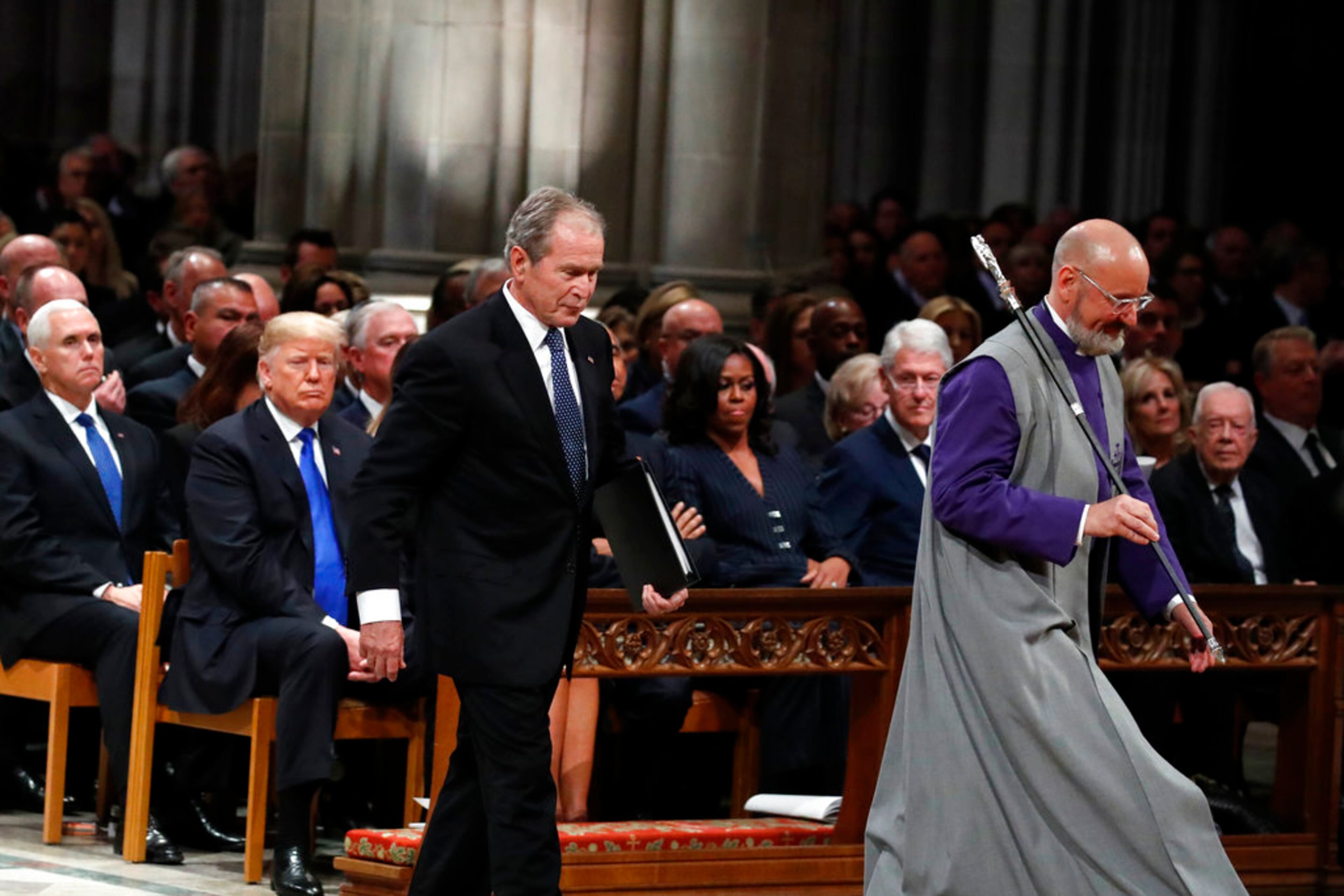 Former President George W. Bush walks to speak at the State Funeral for his father, former President George H.W. Bush, at the State Funeral at the National Cathedral, Wednesday, Dec. 5, 2018, in Washington. (AP Photo/Alex Brandon, Pool)