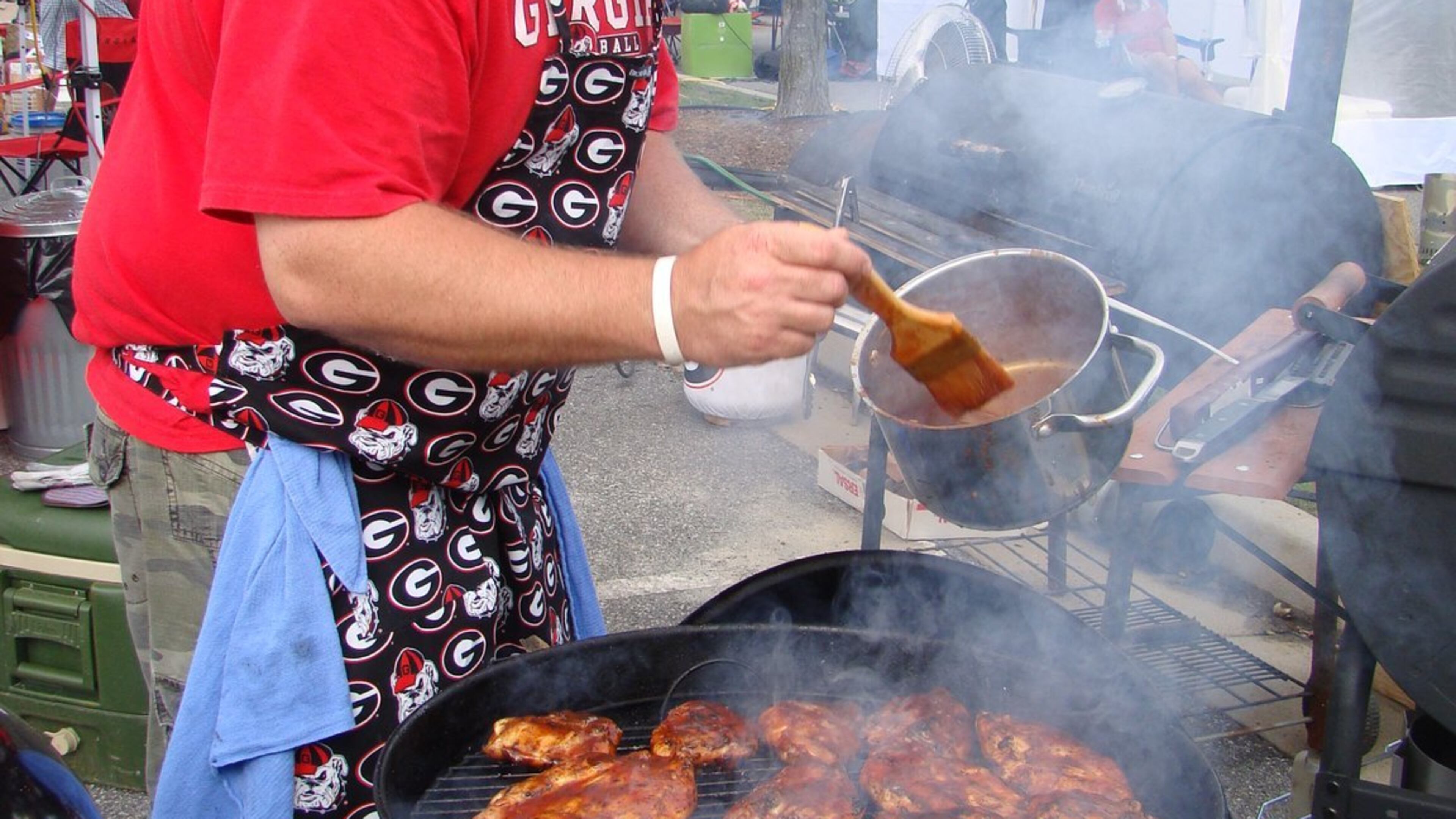 Competitors battle it out at the City of Kennesaw's Pigs & Peaches BBQ Festival. Photo credit: Pigs & Peaches BBQ Festival. HANDOUT PHOTO - NOT FOR RESALE