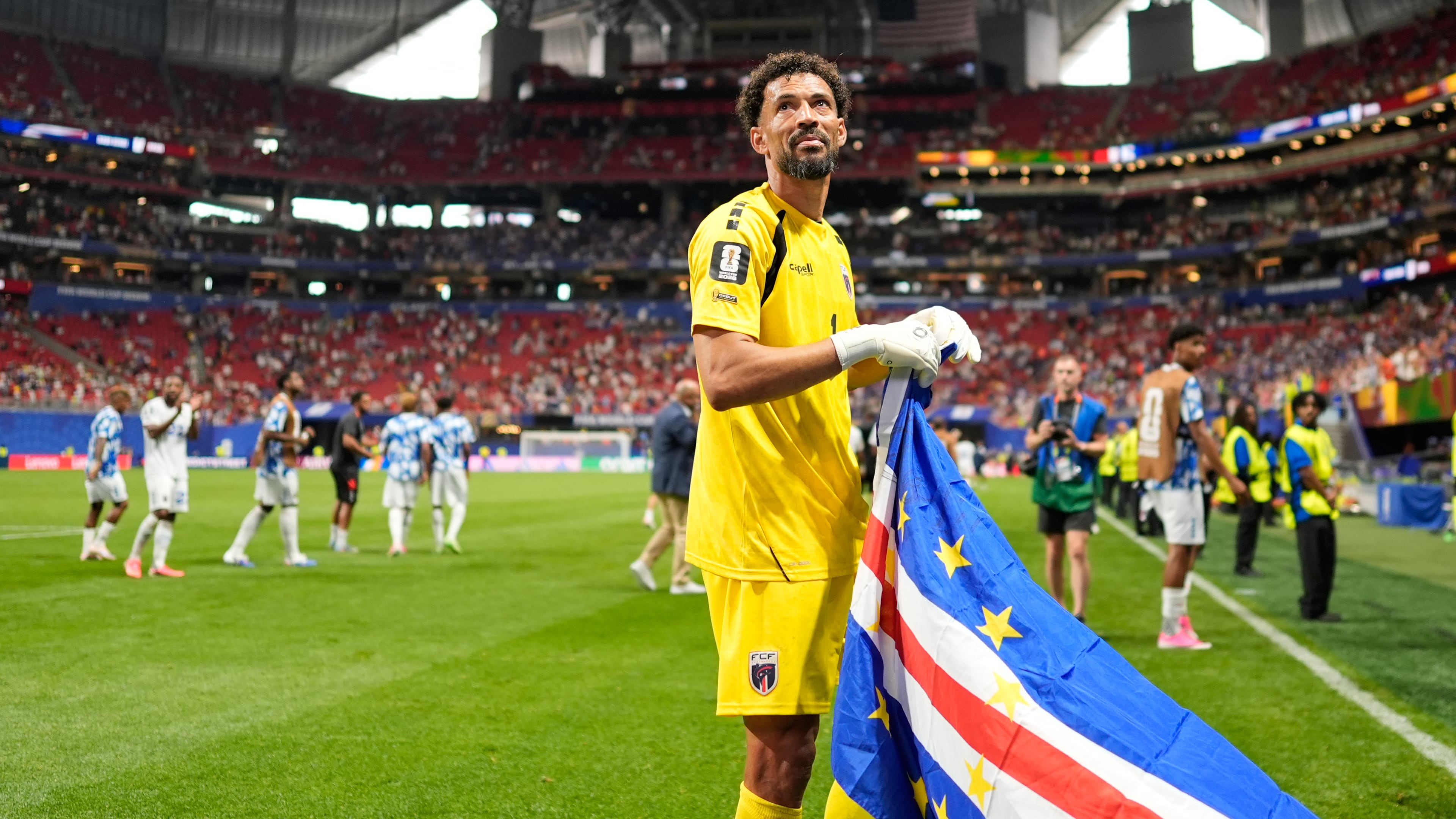 Cape Verde goalkeeper Vozinha celebrates as holds the flag of his country after the World Cup Group H soccer match between Spain and Cape Verde in Atlanta, Monday, June 15, 2026. (AP Photo/Mike Stewart)