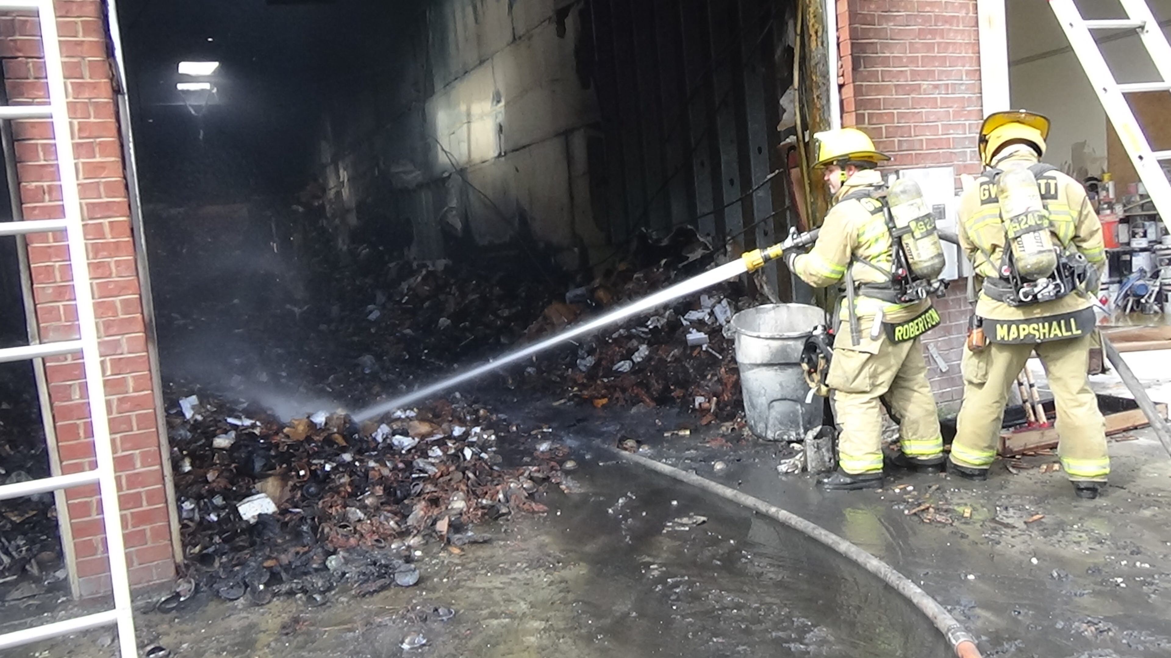 Gwinnett County firefighters extinguish a blaze at Lightcraft Lighting in Suwanee.