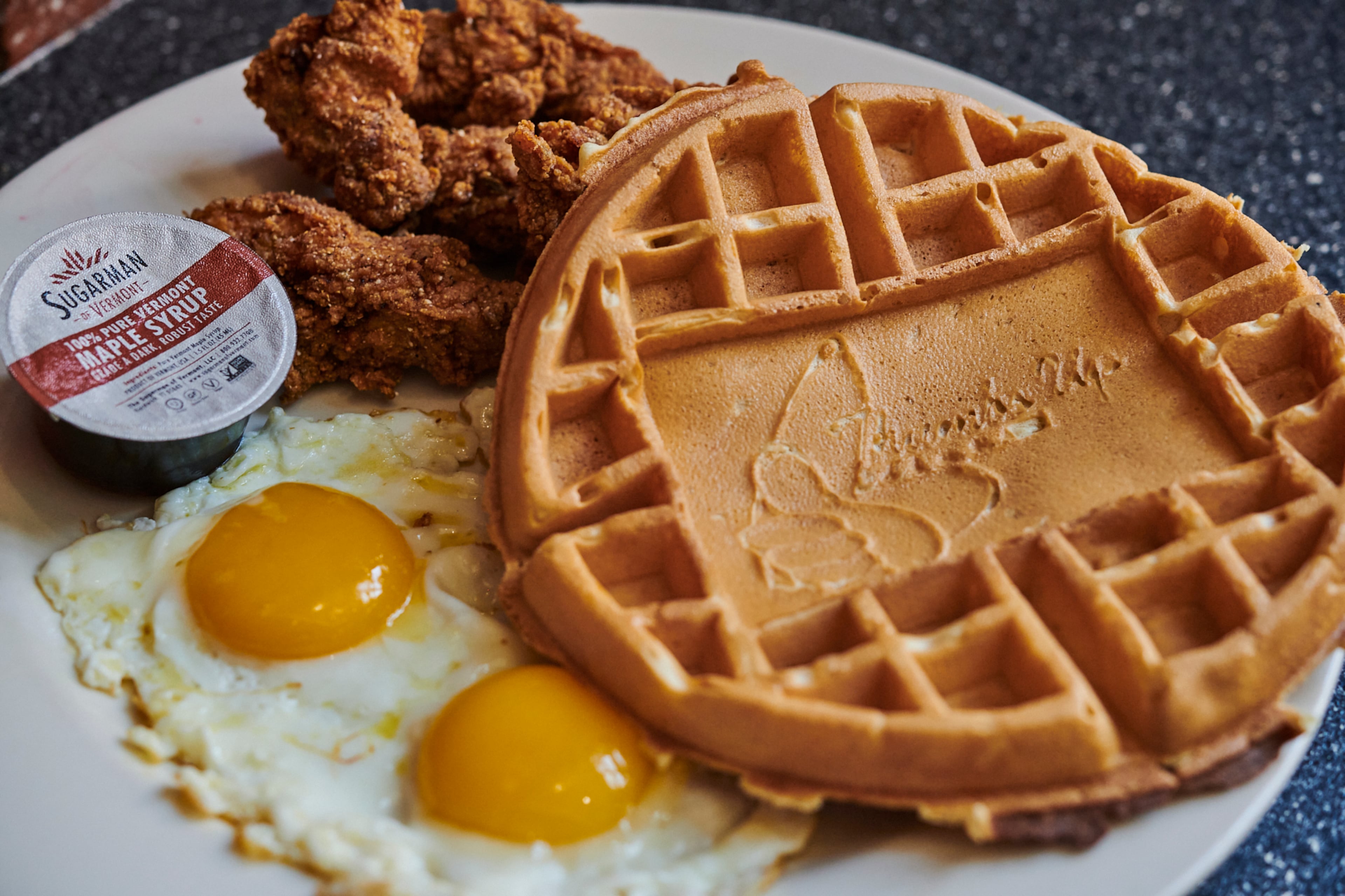 One of the offerings at Thumbs Up Diner in Atlanta is fried chicken breast strips, two eggs any style and a Belgian waffle served with pure maple syrup. (Greg Rannells for The Atlanta Journal-Constitution)