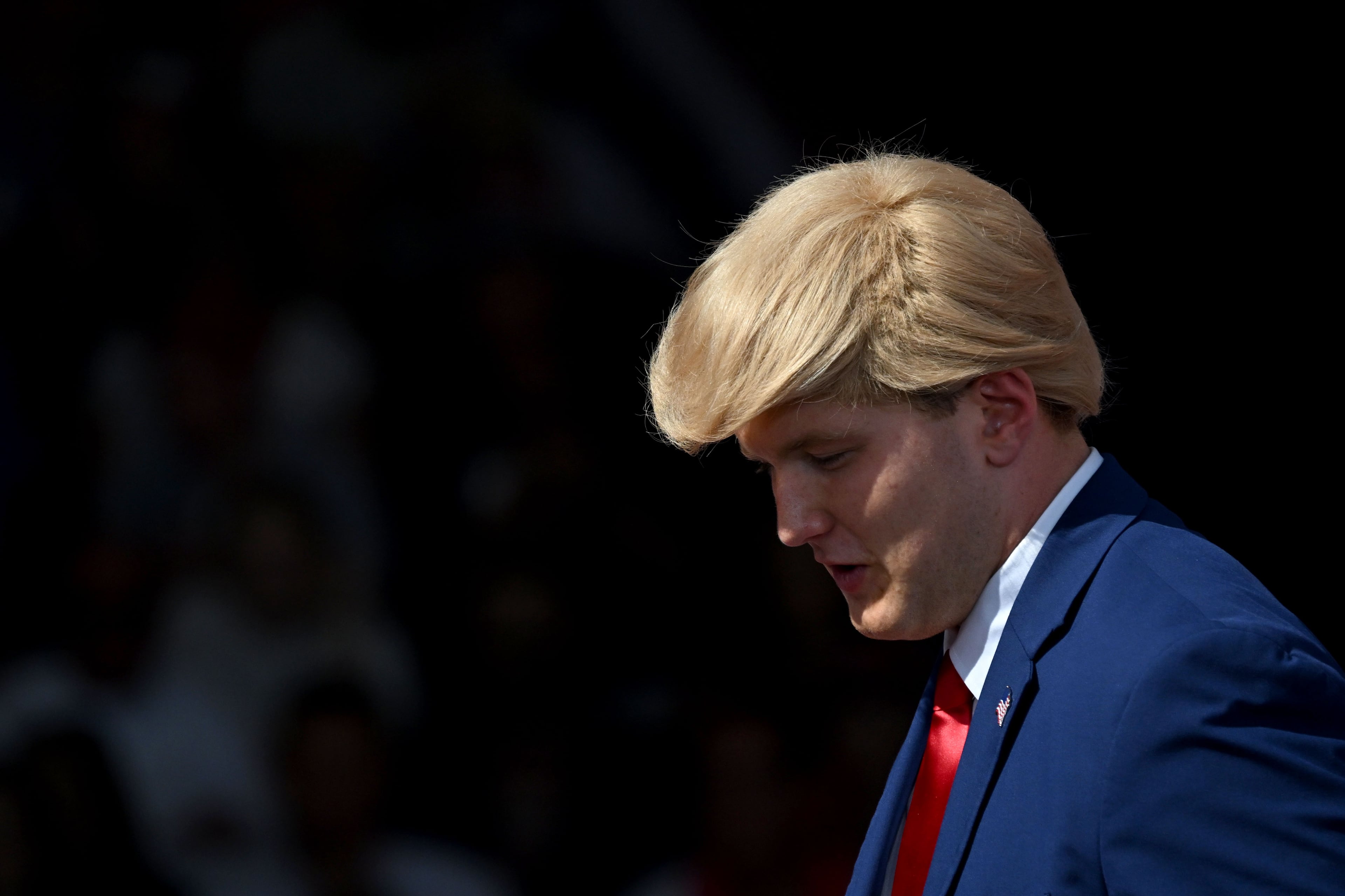 A supporter impersonating President Donald Trump is seen during a campaign rally at Dalton Municipal Airport on Friday, Oct. 16, 2026, in Dalton. (Hyosub Shin/AJC)