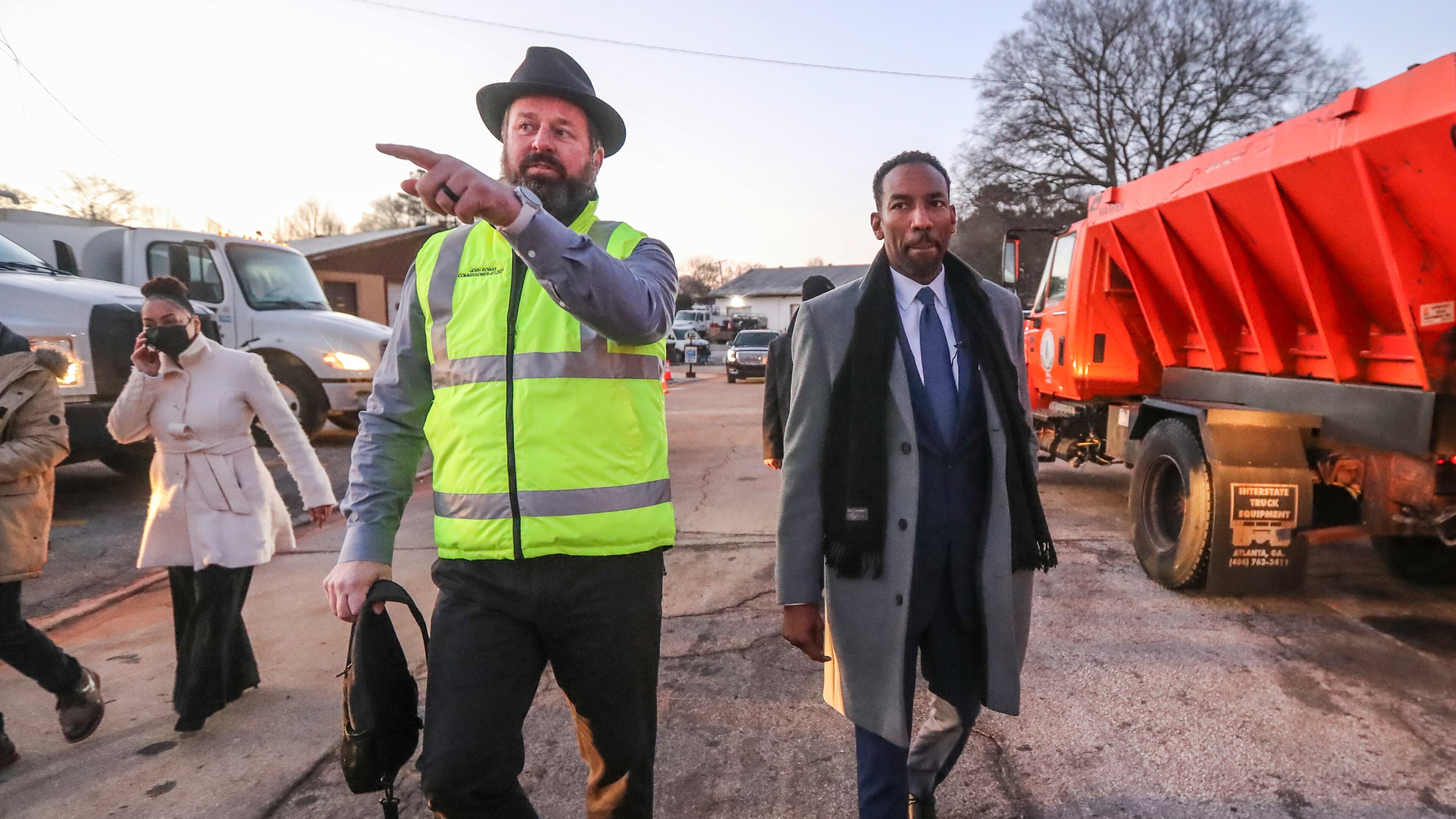 Atlanta Department of Transportation Commissioner Josh Rowan (left) talks to Mayor Andre Dickens about snow preparations at the ATL DOT North Avenue Facility in Atlanta on Friday, Jan. 14, 2022. (John Spink / John.Spink@ajc.com)