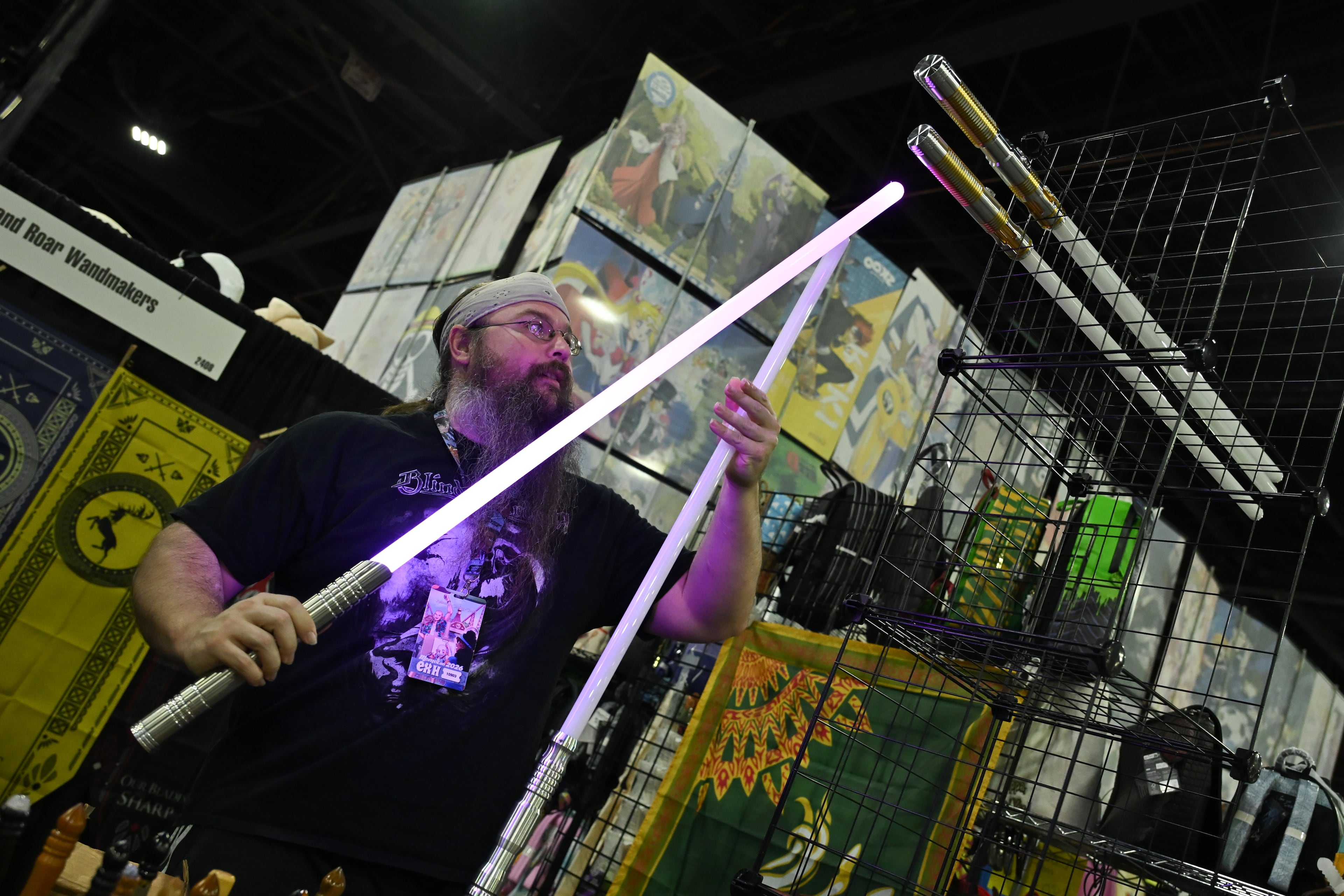 Nathan Love displays his merchandise during MomoCon at the Georgia World Congress Center in Atlanta on Friday, May 22, 2026. Organizers expect over 60,000 attendees. (Tyler Sun for the AJC)