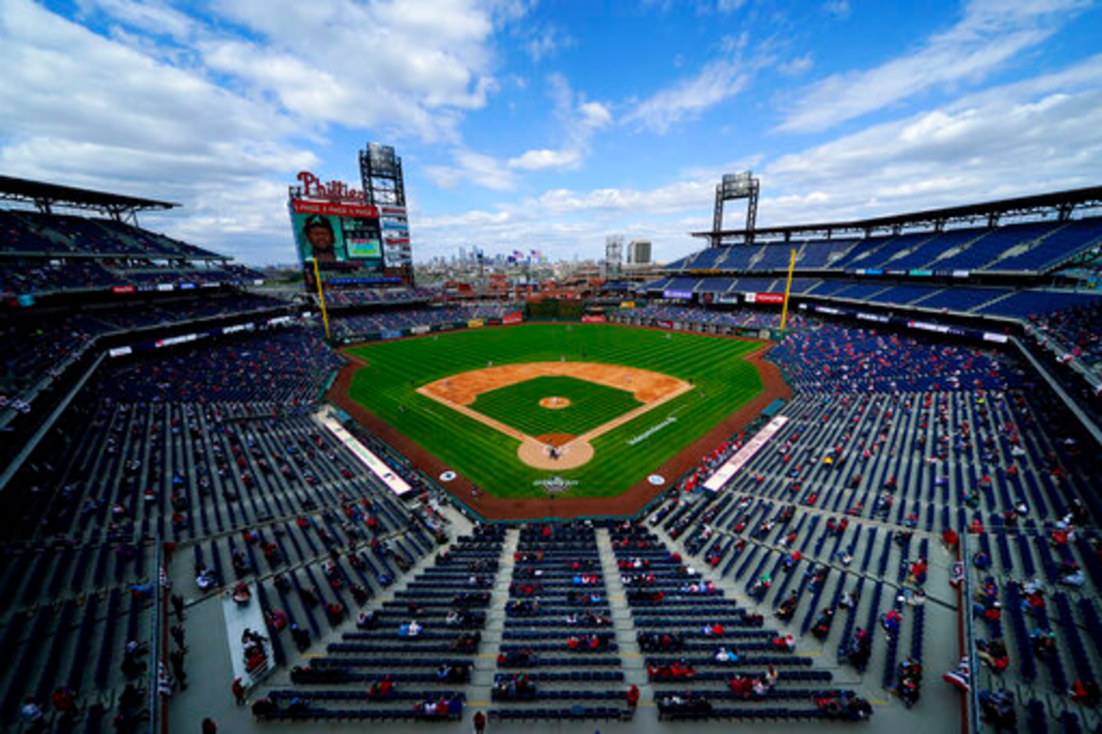 Philadelphia Phillies' Aaron Nola pitches to Atlanta Braves' Ronald Acuna Jr. to start an opening day baseball game, Thursday, April 1, 2021, in Philadelphia. (AP Photo/Matt Slocum)