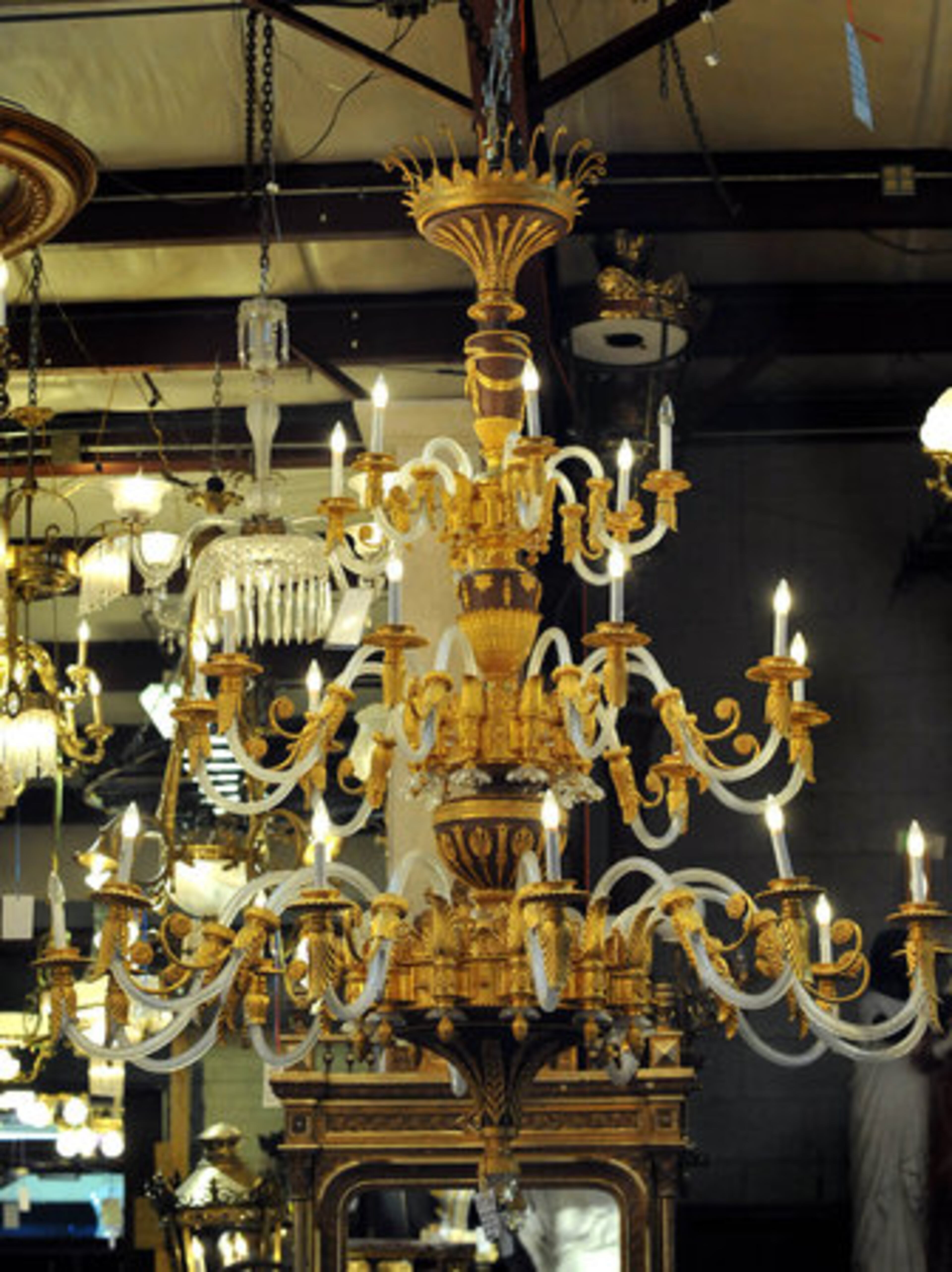 A large patinated bronze and cut glass multi-light chandelier.