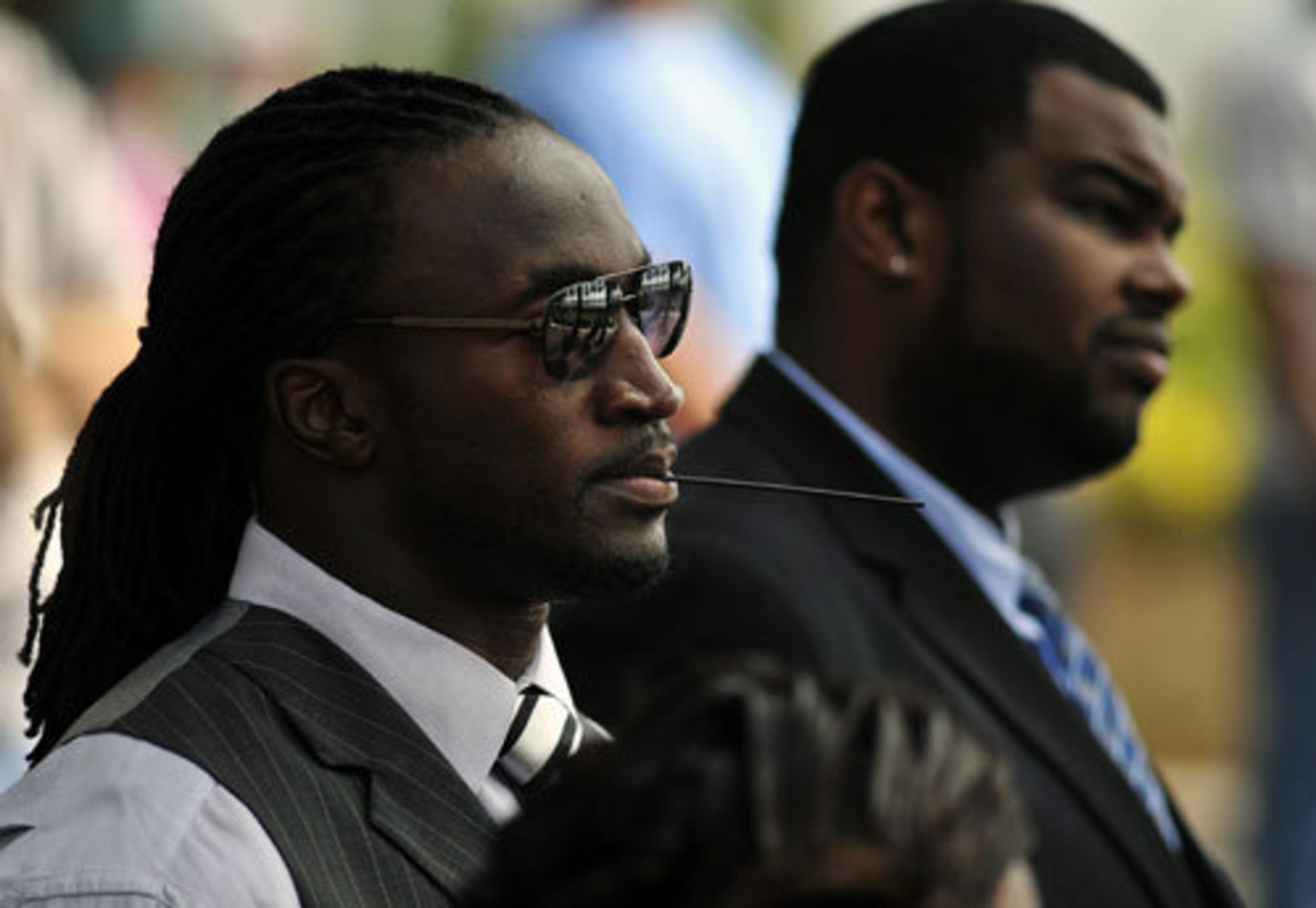 Jacksonville Jaguar running back Greg Jones, left, attends a memorial service.