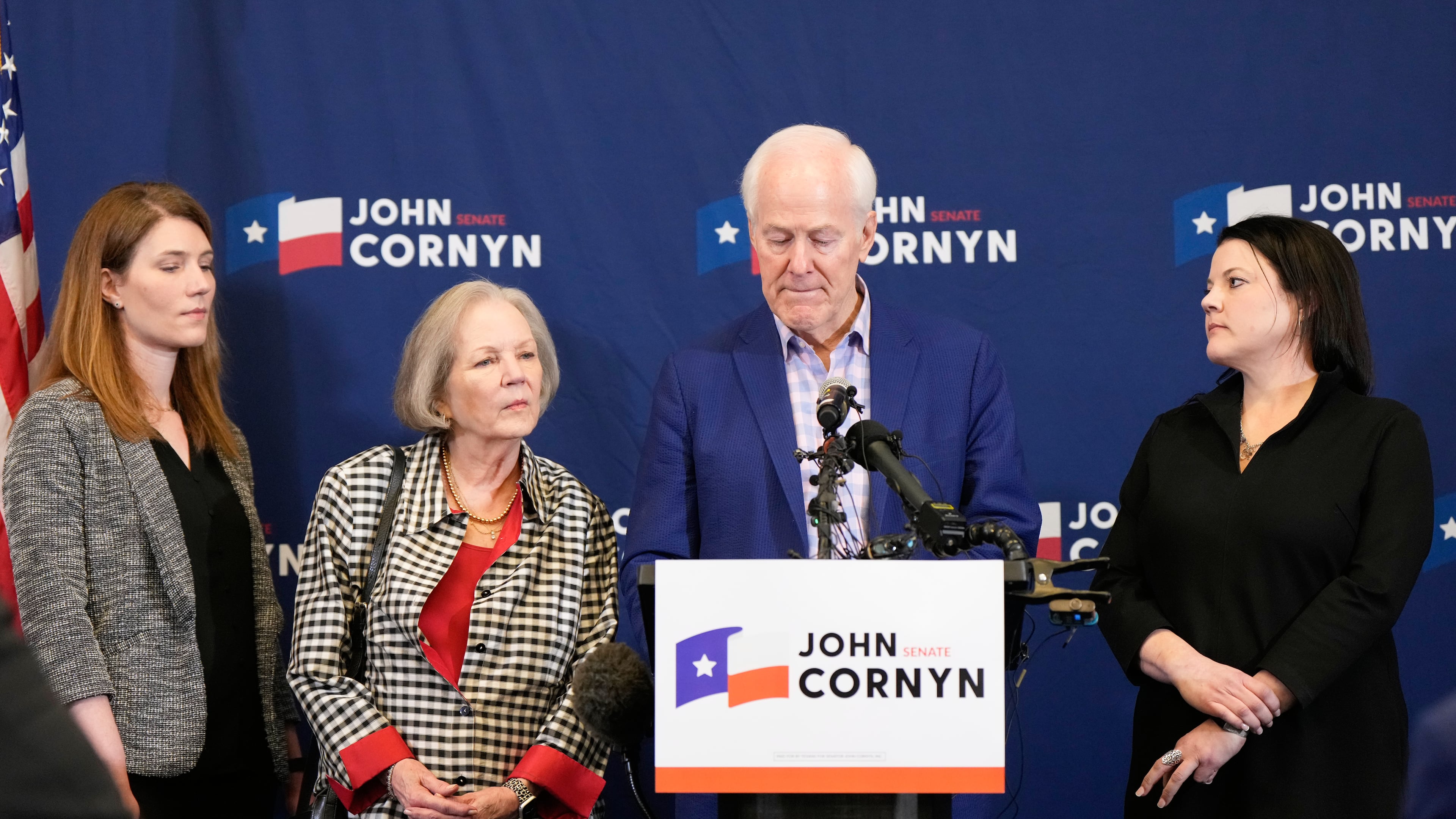 Sen. John Cornyn, R-Texas, center right, speaks alongside, from left, daughter Danley Cornyn, wife Sandy Cornyn and daughter Haley Cornyn, during a primary runoff election night event after losing the Republican party's nomination Tuesday, May 26, 2026, in Austin. (AP Photo/Ashley Landis)