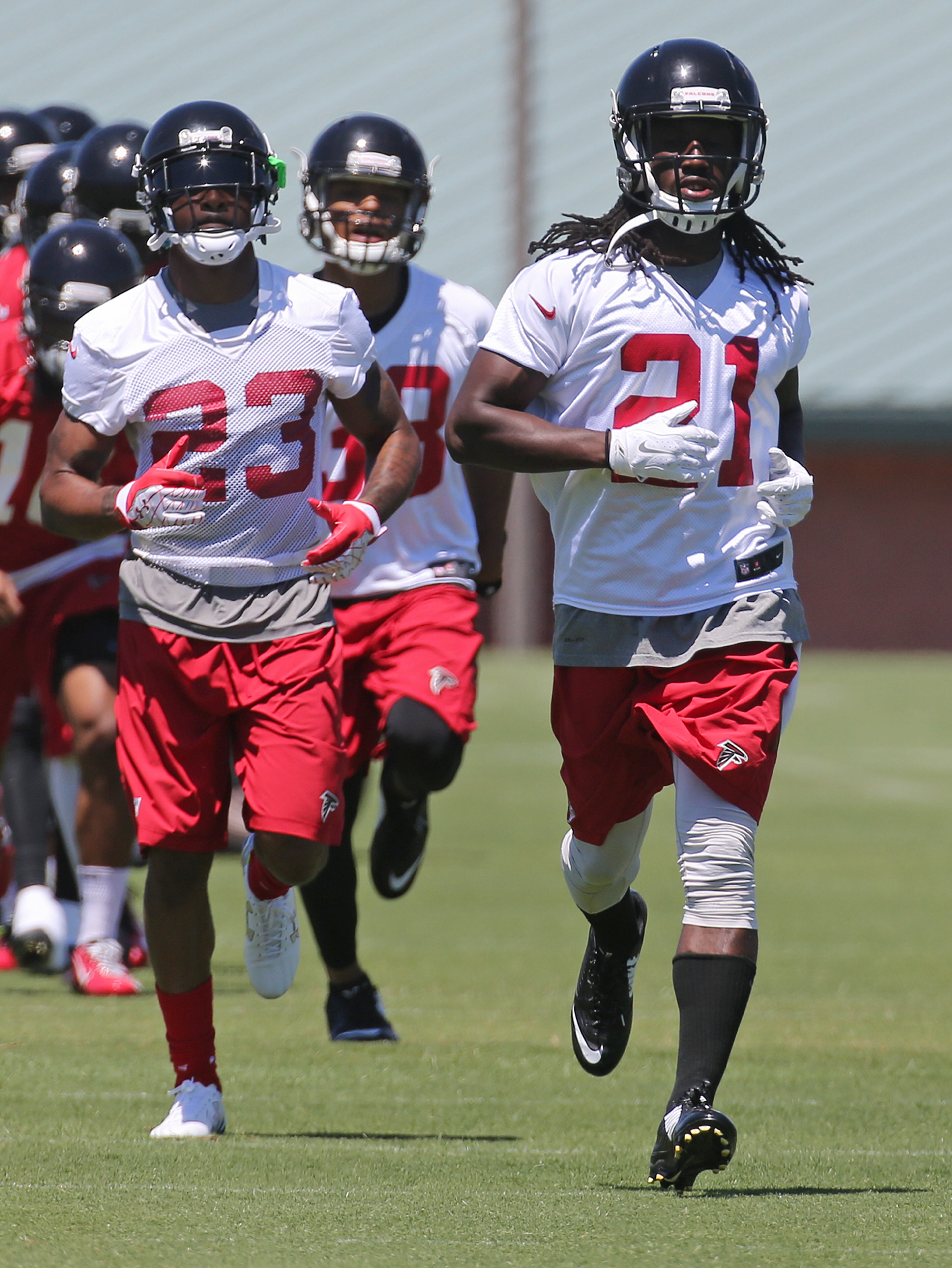 Falcons cornerbacks Desmond Trufant (right) and Robert Alford run sprints during an OTA day on Tuesday, June 7, 2016, in Flowery Branch. Curtis Compton / ccompton@ajc.com