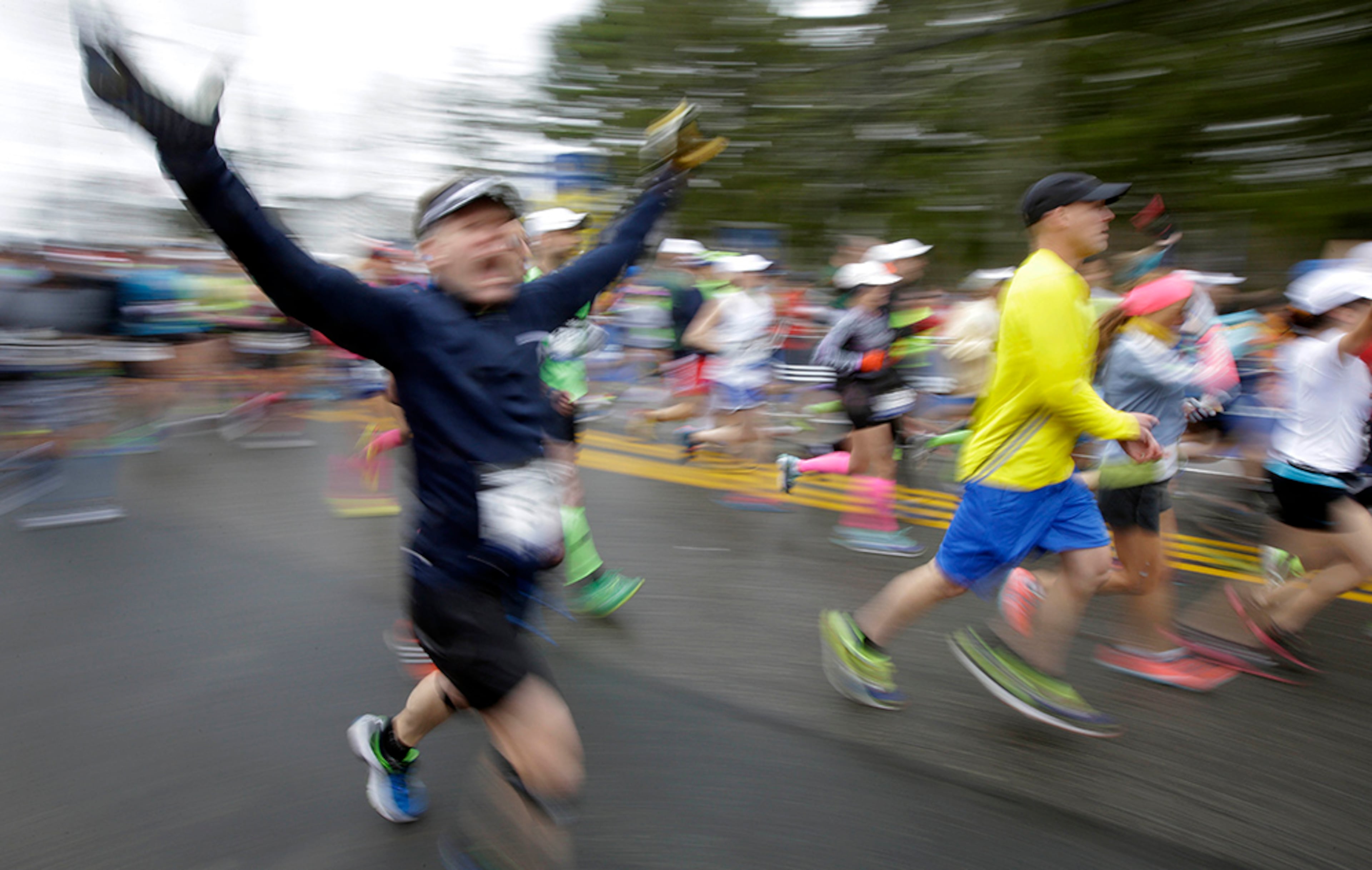 Runners leave the start line of the Boston Marathon Monday, April 20, 2015 in Hopkinton, Mass.