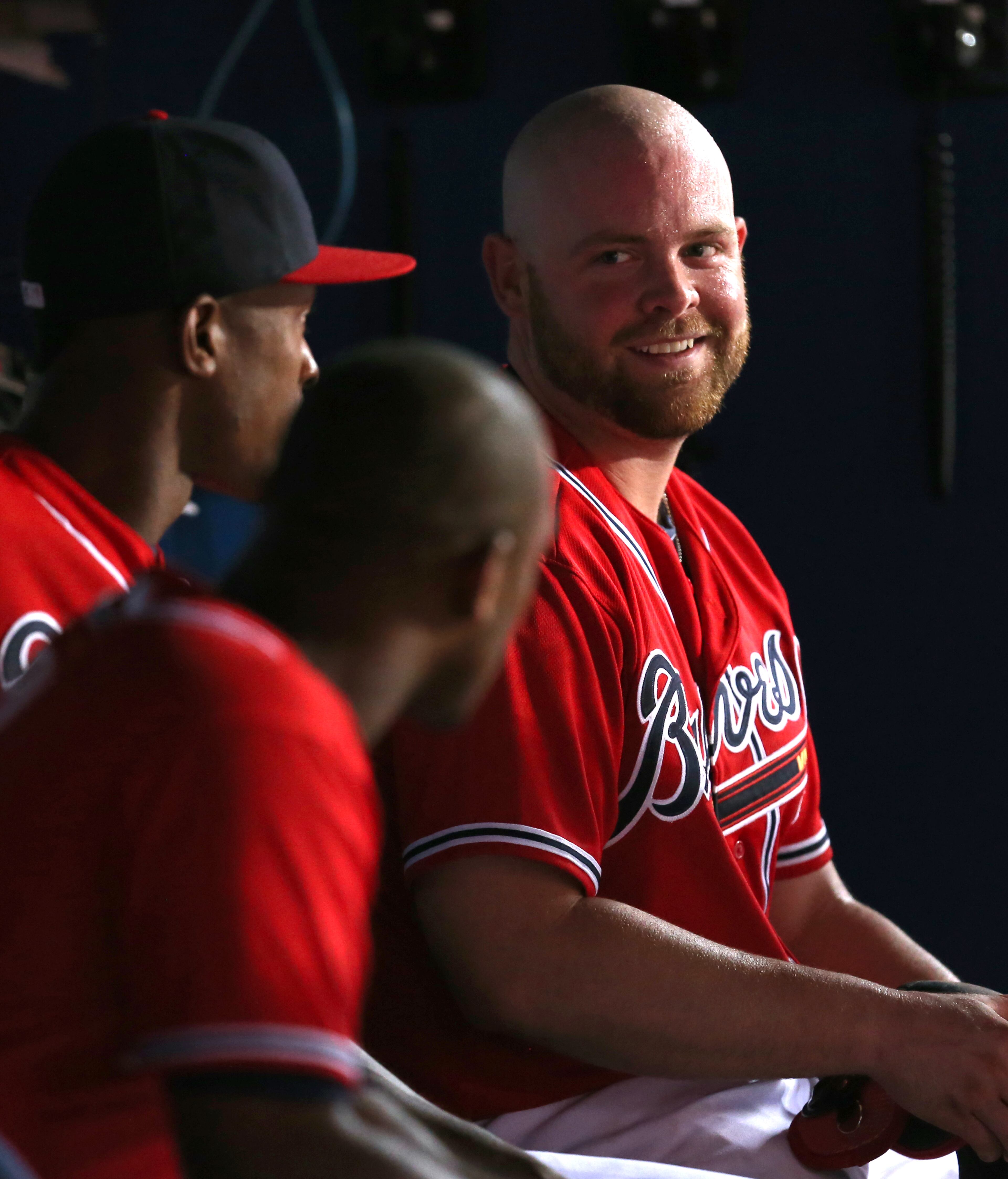 Atlanta Braves catcher Brian McCann talks with teammates after his two-run home run in the 4th inning of their game against the San Diego Padres at Turner Field Friday night in Atlanta, Ga., September 13, 2013. The Braves scored three runs in the 4th inning. JASON GETZ / JGETZ@AJC.COM