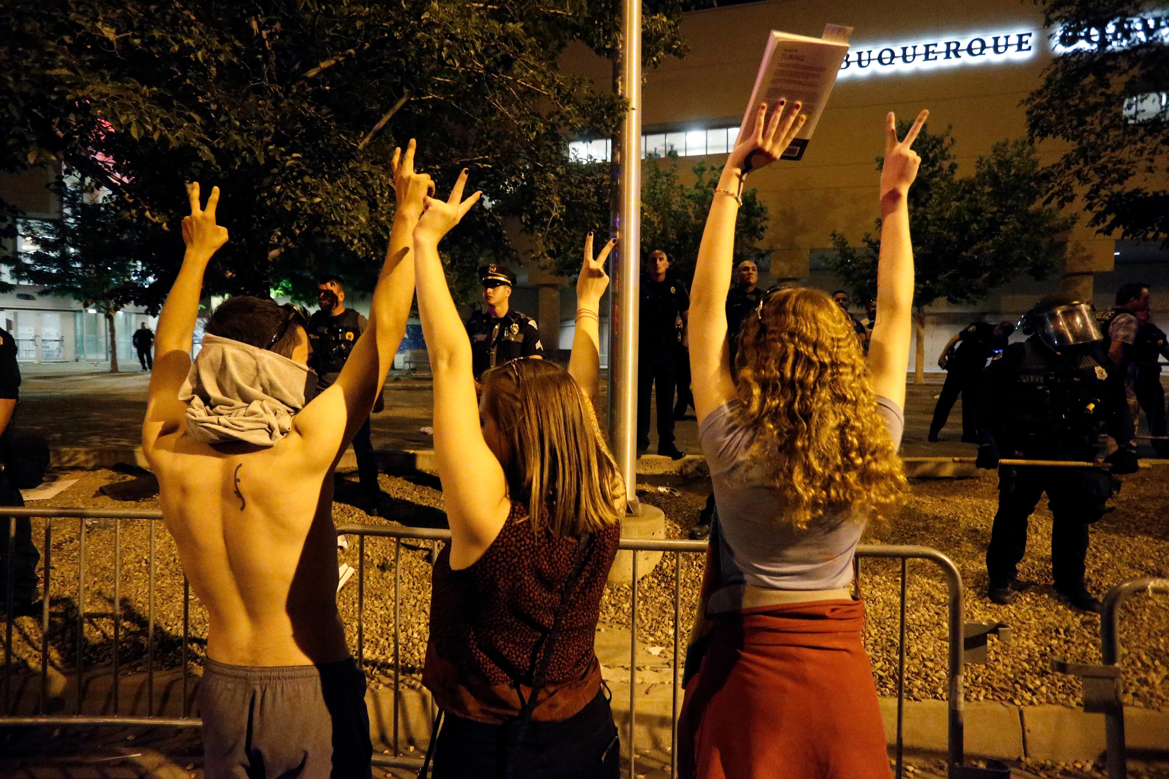 Police block off the Albuquerque Convention Center to anti-Trump protests following a rally and speech by Republican presidential candidate Donald Trump at the convention center where the event was held, in Albuquerque, N.M., Tuesday, May 24, 2016. (AP Photo/Brennan Linsley)