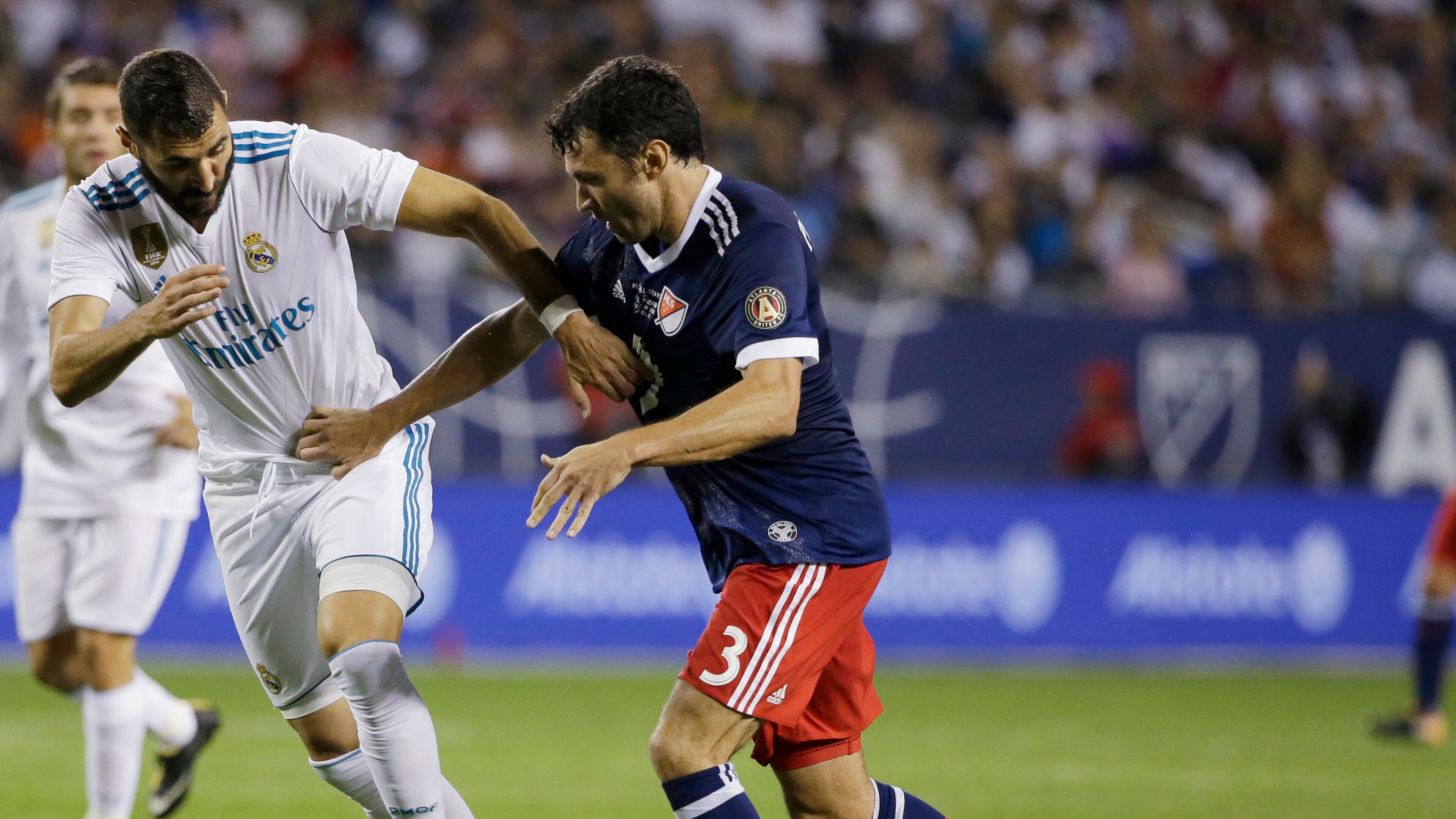 Real Madrid's Karim Benzema, left, and MLS All-Stars' Michael Parkhurst vie for the ball during the second half of the MLS All-Star Game, Wednesday, Aug. 2, 2017, in Chicago. Real Madrid won the game. (AP Photo/Nam Y. Huh)