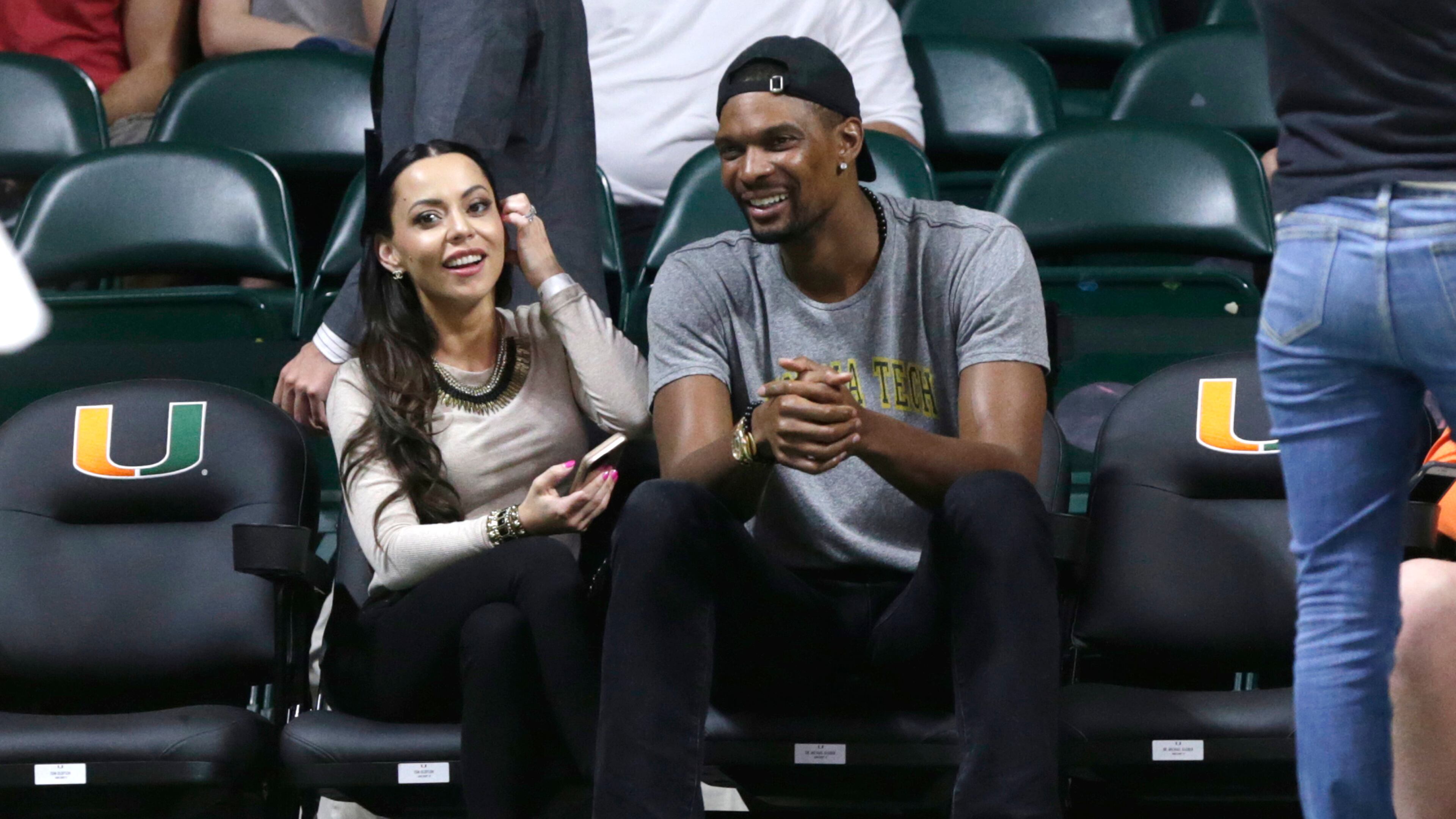 Miami Heat forward Chris Bosh and his wife, Adrienne, attend an NCAA college basketball game between Miami and Georgia Tech, Wednesday, Feb. 15, 2017, in Coral Gables, Fla. (AP Photo/Lynne Sladky)
