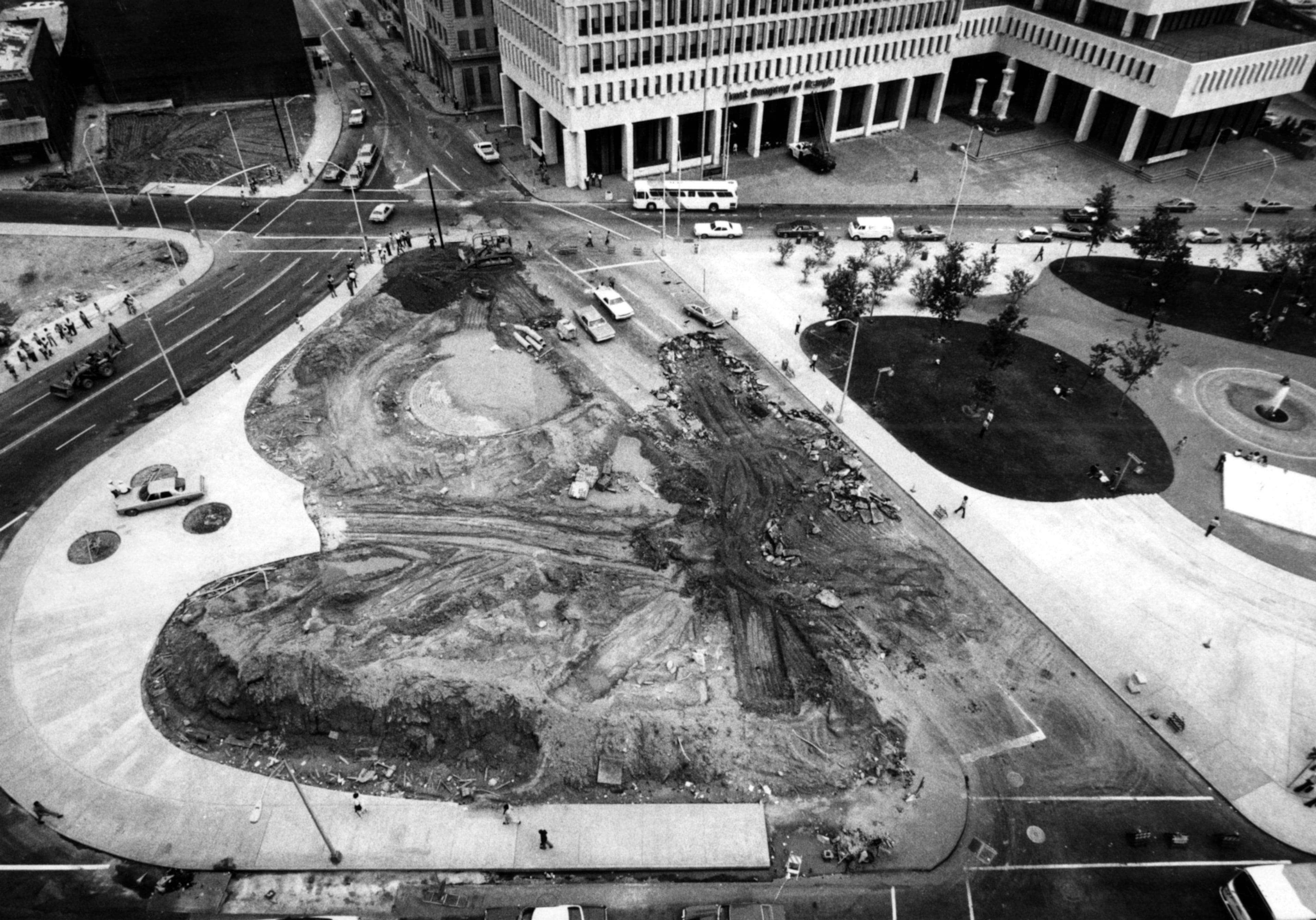 Aug. 13, 1975 - Atlanta, Ga. - An extension of Auburn Avenue (left) has been opened to traffic during the continuing work on the expansion of Central City Park. Pryor Street is shown across the top of this photo, while Peachtree Street is at the bottom. Auburn Avenue eventually becomes Luckie Street in downtown Atlanta. The excavation in the center is the former site of Auburn Avenue, which was closed to enable enlargement of the popular park. (Dwight Ross Jr./AJC staff) 1975